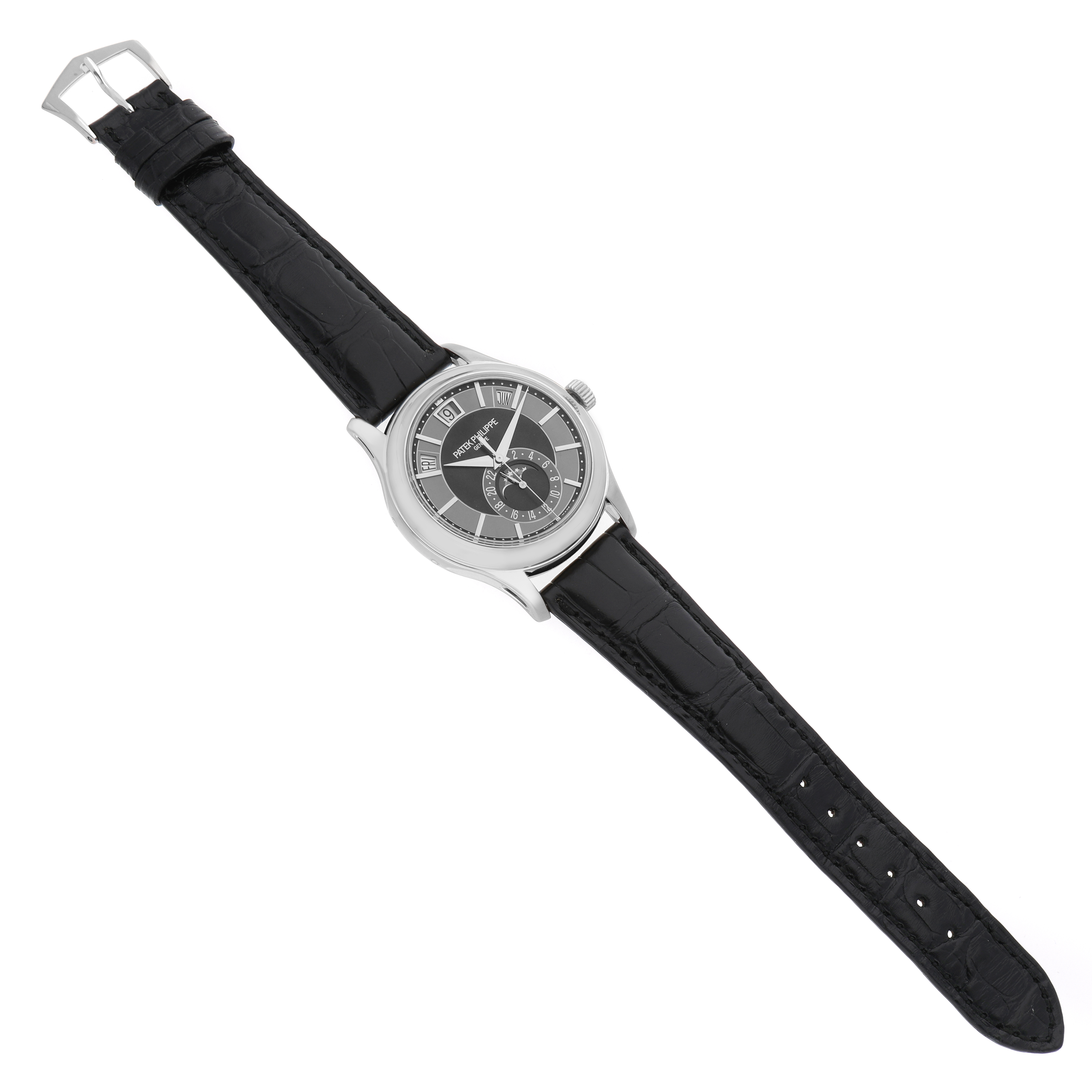 The Patek Philippe Complications 5205G-010 Men's White Gold Grey Dial watch is shown from an overhead angle, displaying the face, case, and full leather strap.