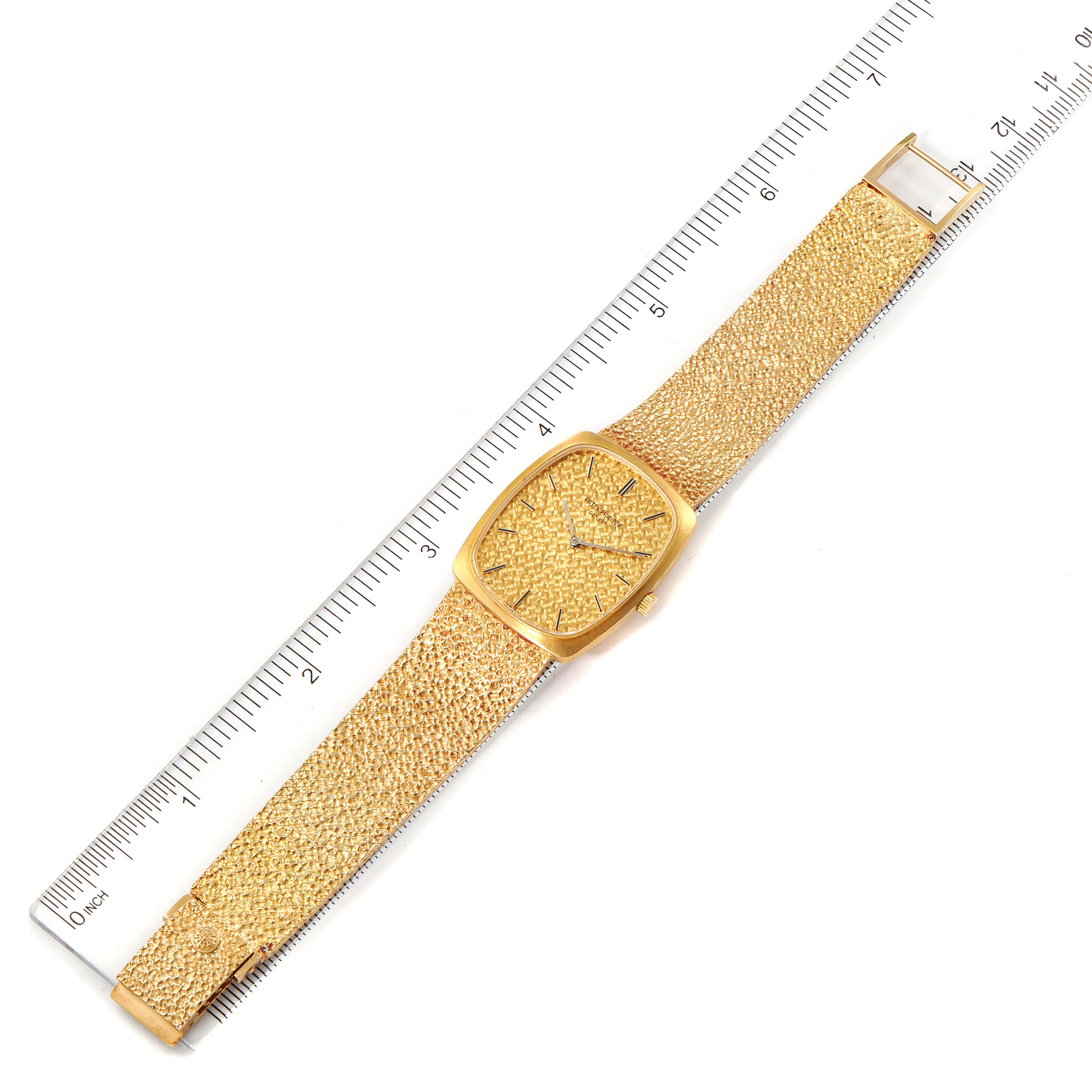 The image shows a top-down view of a Vintage Patek Philippe watch with the dial, strap, and buckle visible, placed next to a ruler.