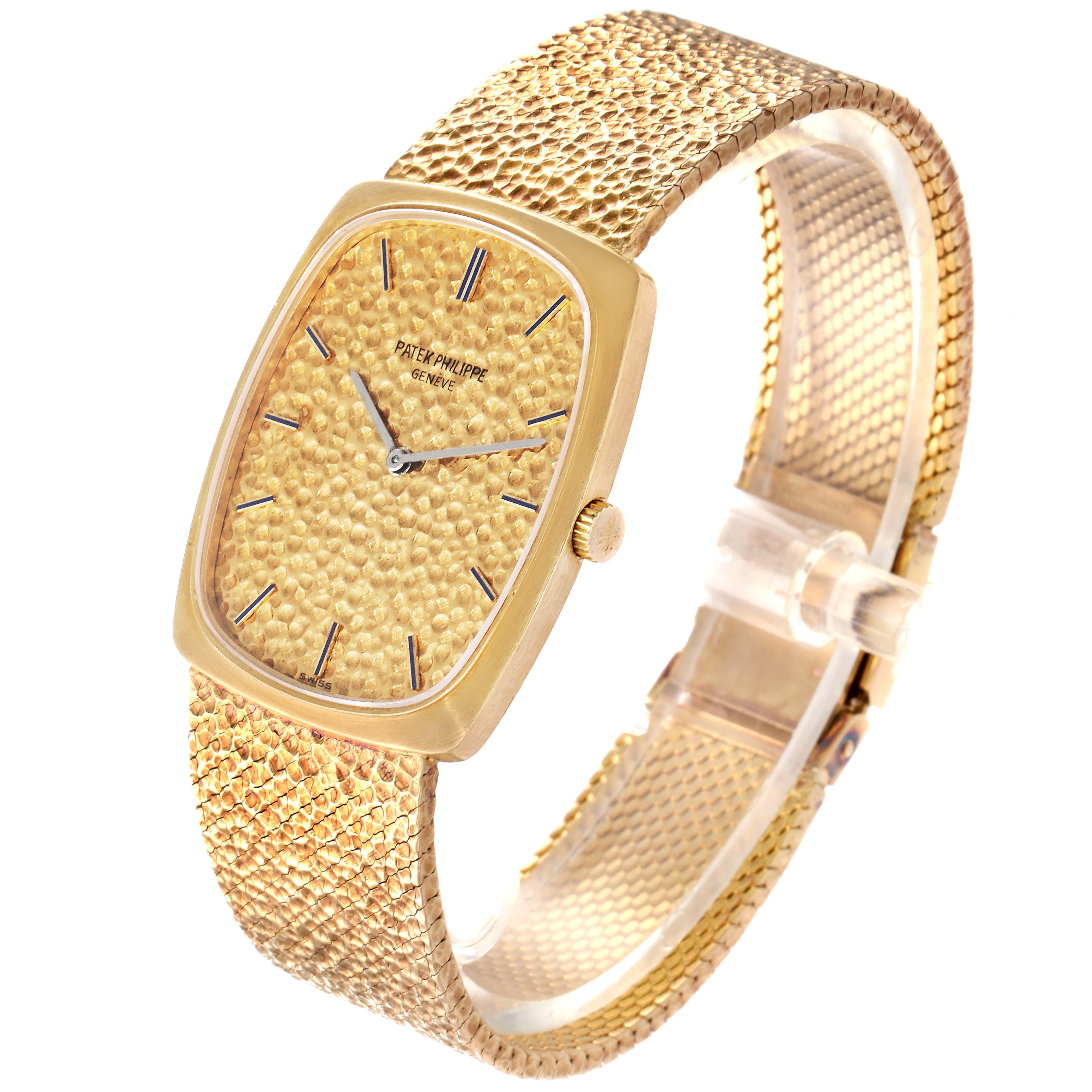 This image shows a side angle of the Patek Philippe Vintage 3567/1 Men's Yellow Gold Champagne Dial 3567/1 Men's Yellow Gold Champagne Dial watch, highlighting its textured gold face, strap, and gold case.