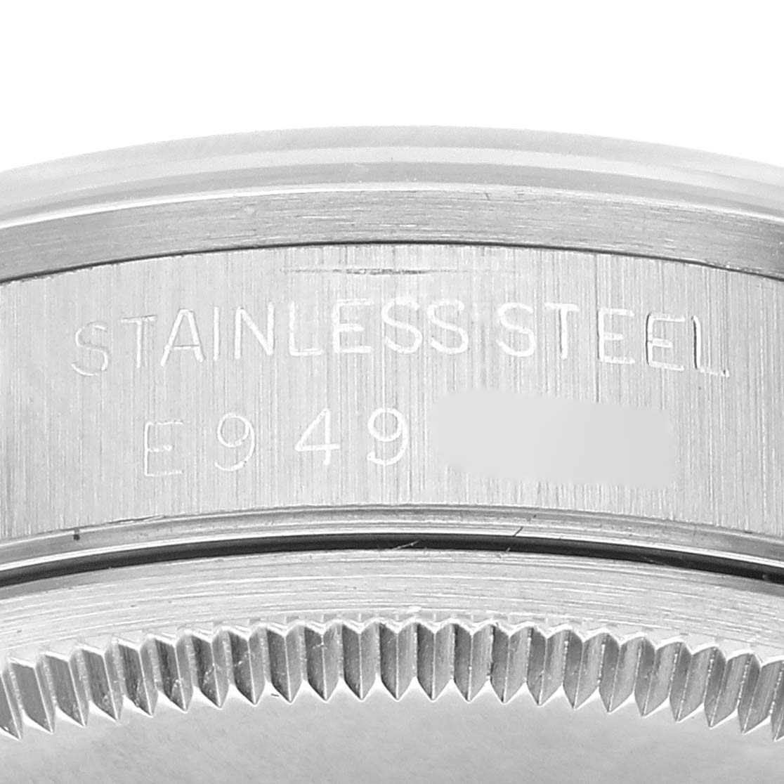 The image shows a close-up of the side of a Rolex Air-King 14000 Men's Stainless Steel Silver Dial 14000 Men's Stainless Steel Silver Dial watch, highlighting the stainless steel case and partially visible serial number.