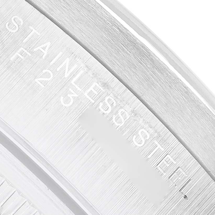 The image shows a close-up of the engraved "STAINLESS STEEL" marking on the Rolex Air-King 14010 Men's Stainless Steel Black Dial watch's case.