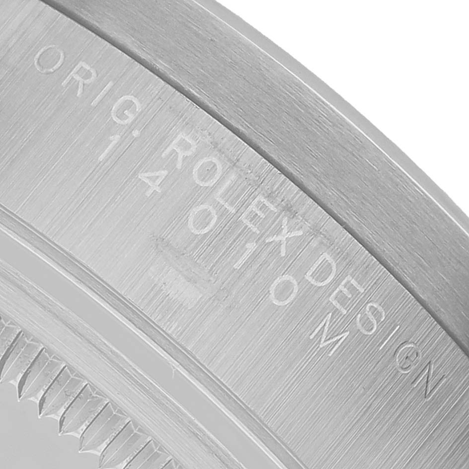 The image shows a close-up of the case back edge of a Rolex Air-King 14010 Men's Stainless Steel Black Dial, featuring engraved text.