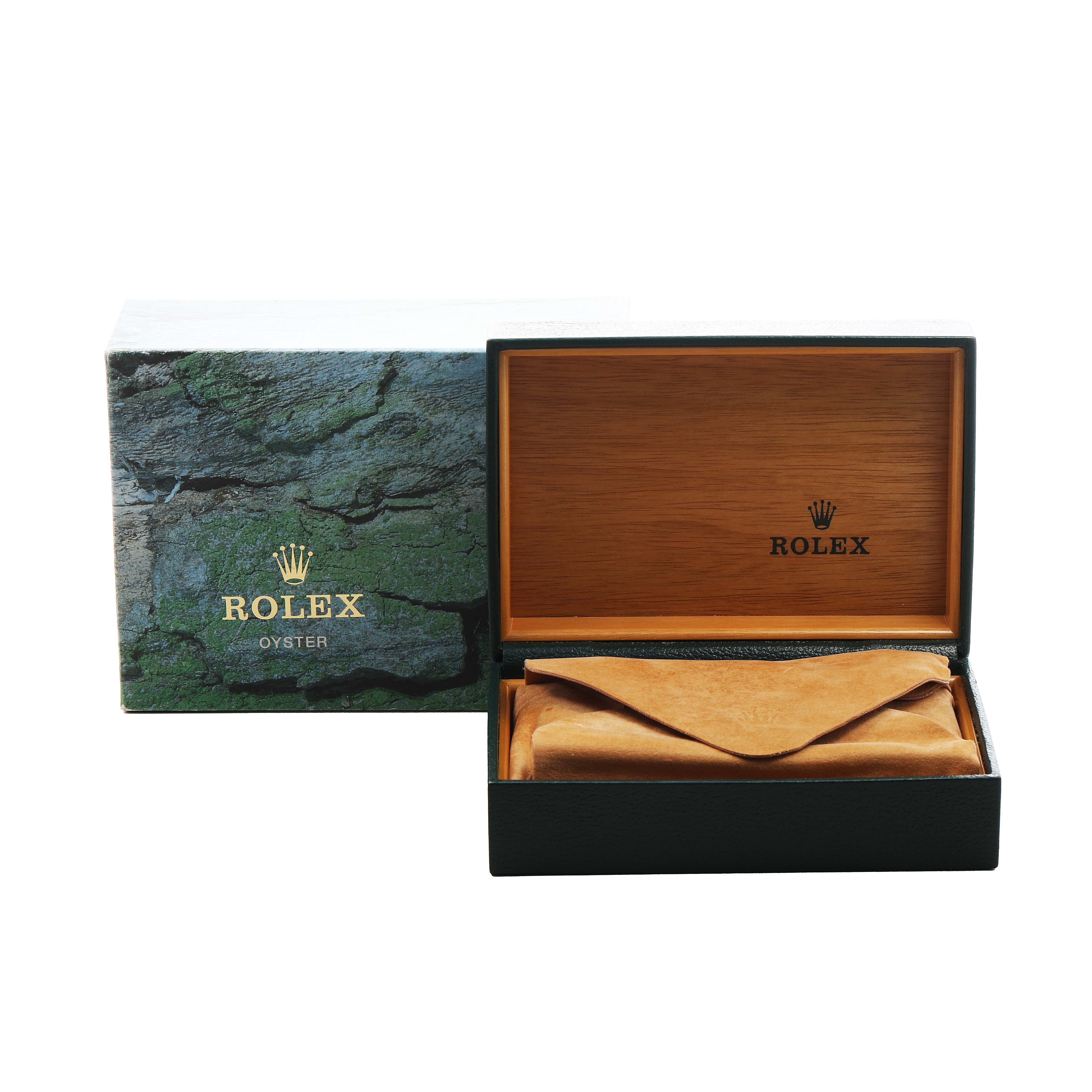 The image shows a Rolex Air-King 14010 Men's Stainless Steel Black Dial box and packaging at an angle highlighting the open wooden interior and leather pouch.
