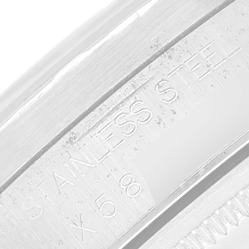 This is a close-up image of the stainless steel part of a Rolex Air-King 14010 Men's Stainless Steel Silver Dial 14010 Men's Stainless Steel Silver Dial watch, showing engraved details.