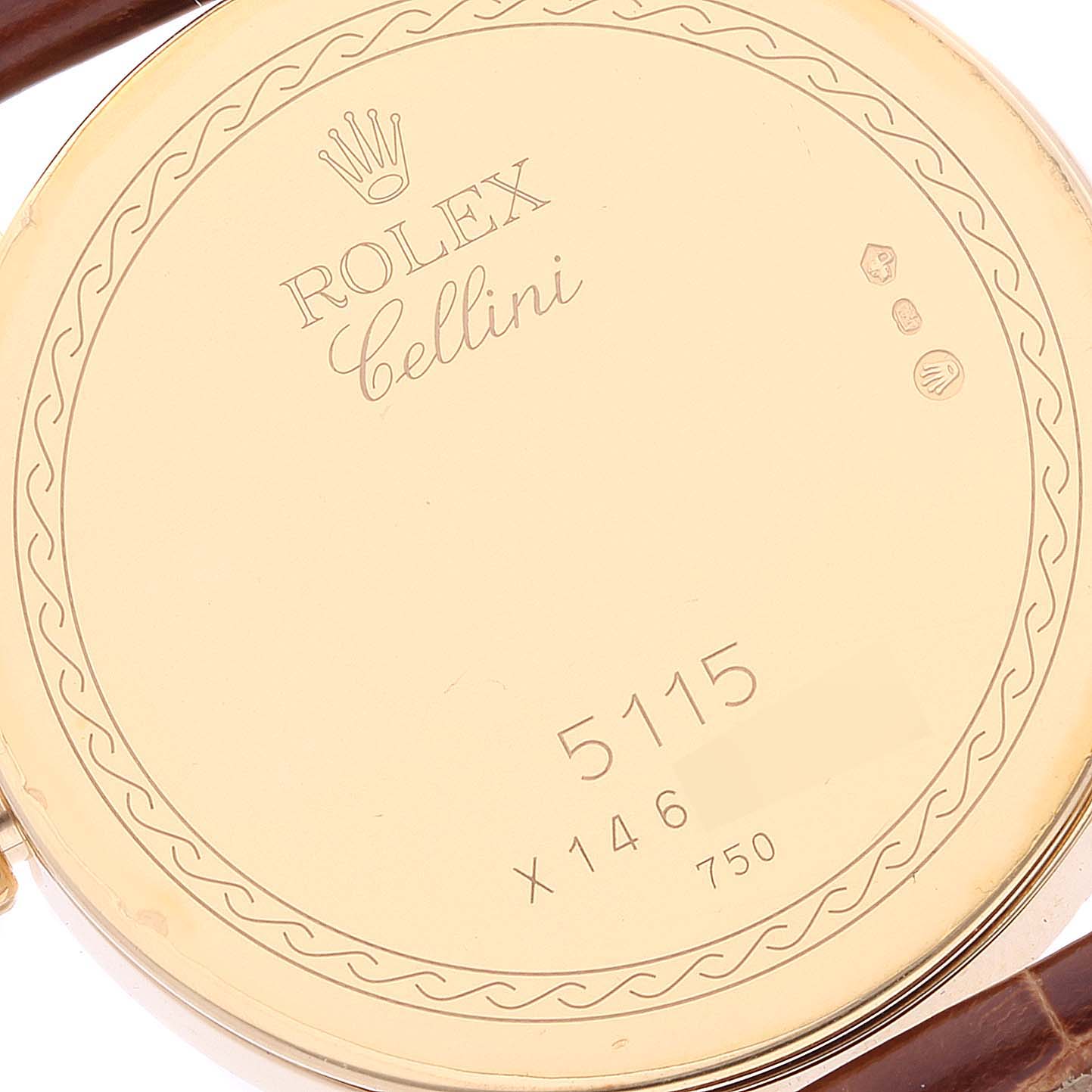 The image shows the backside of a Rolex Cellini 5115 Men's Yellow Gold Beige Dial 5115 Men's Yellow Gold Beige Dial watch, highlighting its engraved details and numbering.
