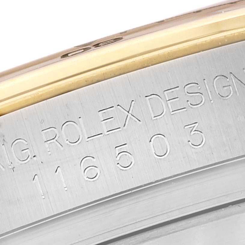 This image shows an angled close-up of the case side of a Rolex Daytona 116503 Men's Steel and Gold (two tone) White Dial 116503 Men's Steel and Gold (two tone) White Dial watch, highlighting the engraving.