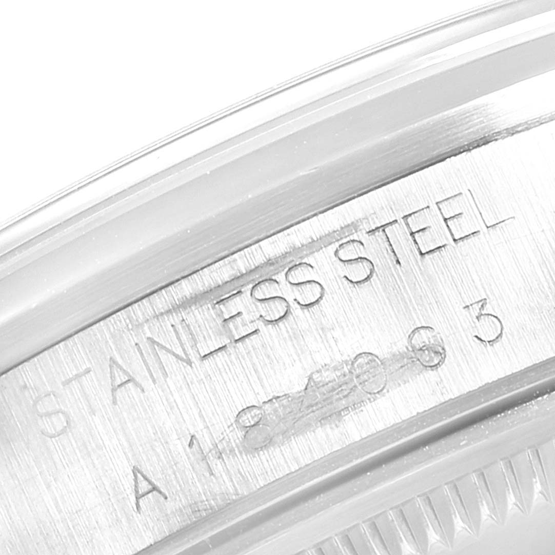 The image shows a close-up of the side of a Rolex Date 15200 Men's Stainless Steel Black Dial 15200 Men's Stainless Steel Black Dial model with "Stainless Steel" engraved.