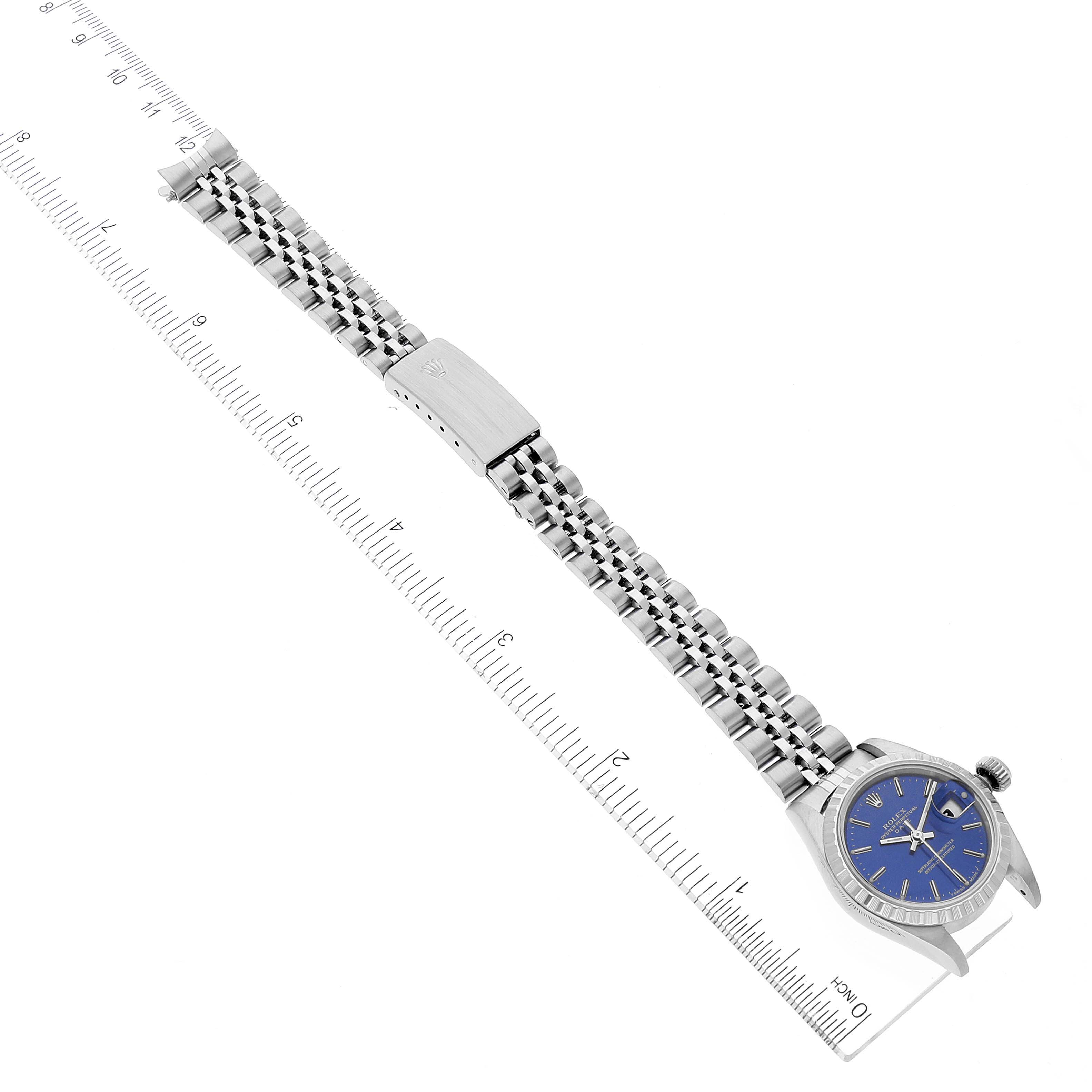 The image shows a Rolex Date 69240 Women's Stainless Steel Blue Dial 69240 Women's Stainless Steel Blue Dial model watch laid flat, displaying the face, bracelet, and clasp positioned at an angle.
