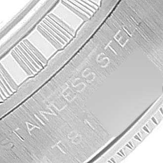 This image shows a close-up of the Rolex Date 69240 Women's Stainless Steel Blue Dial 69240 Women's Stainless Steel Blue Dial model watch's inner bezel with part of the "STAINLESS STEEL" engraving visible.