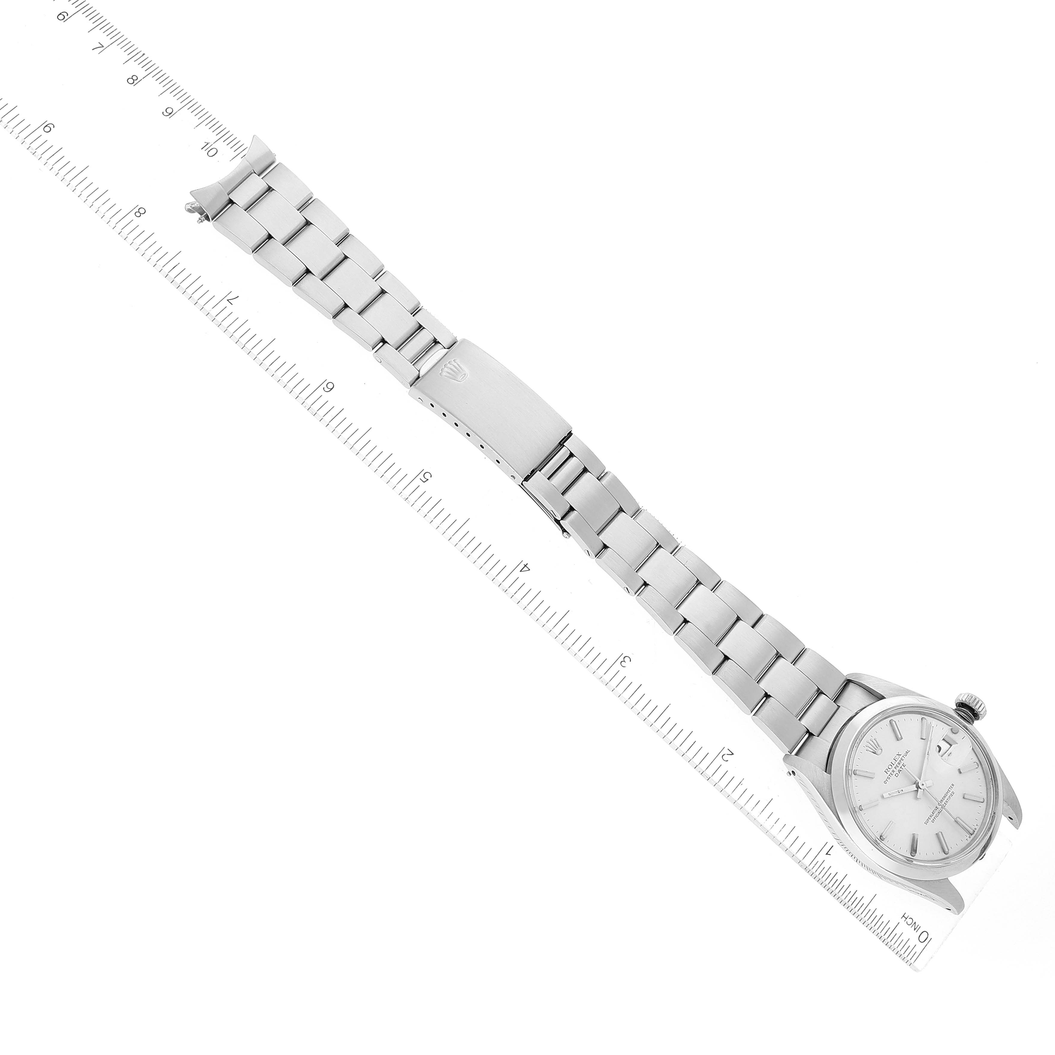 The image shows the Rolex Vintage Collection 1500 Men's Stainless Steel Silver Dial 1500 Men's Stainless Steel Silver Dial watch laid flat, displaying the full face, bracelet, and clasp beside a ruler.