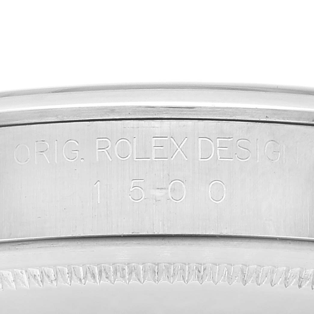 This close-up image shows the engraved case and bezel of the Rolex Date 1500 Men's Stainless Steel Silver Dial 1500 Men's Stainless Steel Silver Dial model.