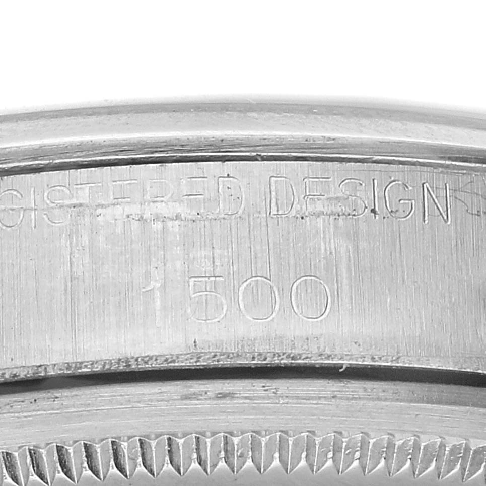 The image shows a close-up of the side of a Rolex Date 1500 Men's Stainless Steel Silver Dial 1500 Men's Stainless Steel Silver Dial model watch, focusing on the serial number engraved on the case.