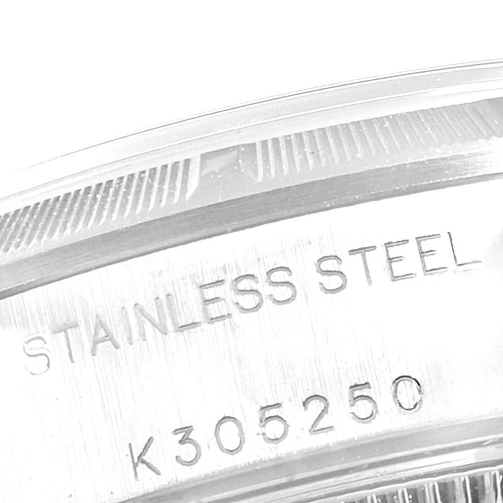 Close-up of the engravings on the outer rim of a Rolex Date 79190 Women
s Stainless Steel White Dial 79190 Women
s Stainless Steel White Dial stainless steel watch case, showing material and serial number.