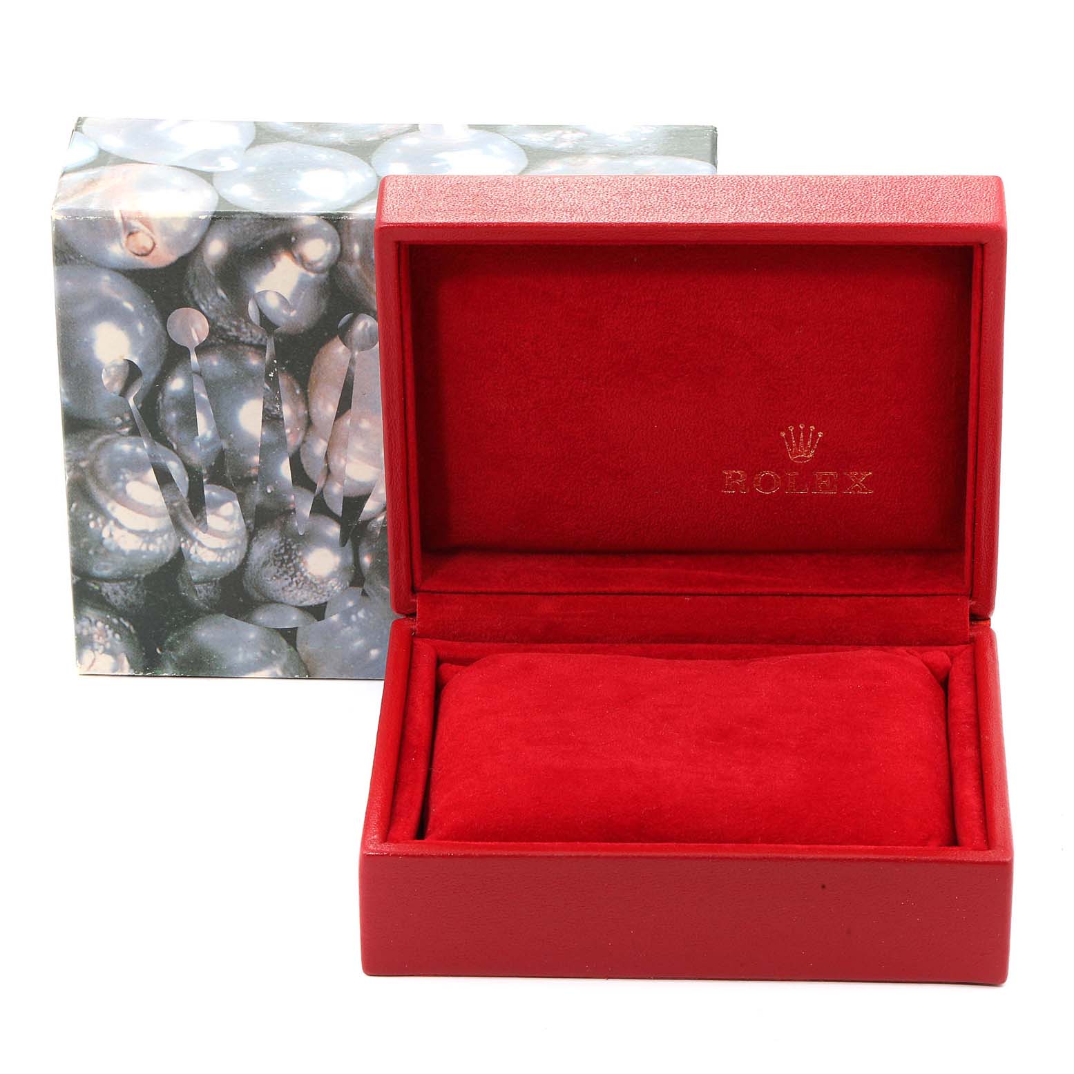 This image shows an open, red Rolex watch box for the Date model, with its outer packaging visible in the background.