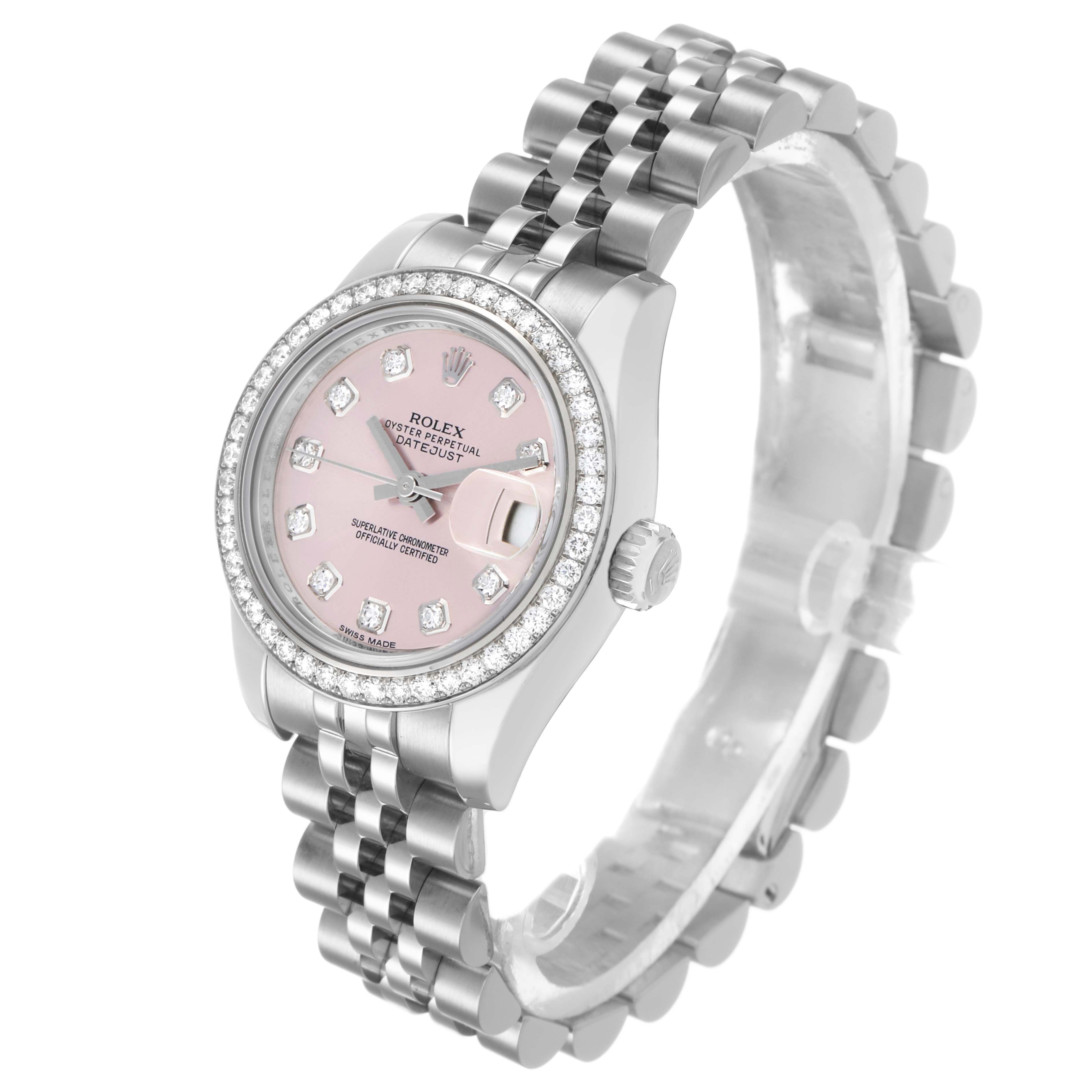 The Rolex Datejust 179384 Women's Stainless Steel Pink Dial watch is shown at a three-quarter angle, highlighting its pink dial, diamond bezel, and Jubilee bracelet.
