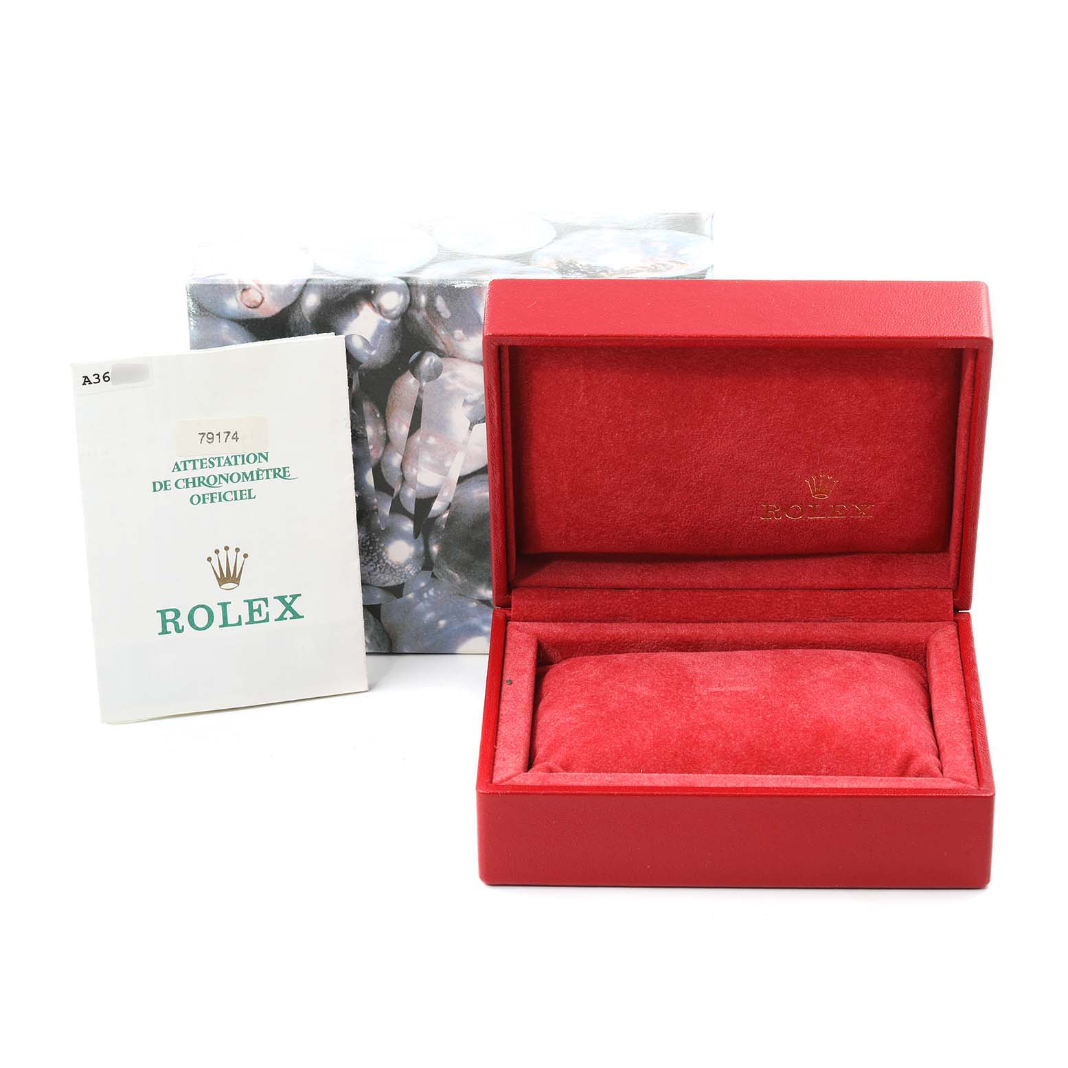 This image shows an empty Rolex Datejust 79174 Women
s Stainless Steel Black Dial 79174 Women
s Stainless Steel Black Dial watch box with a certification booklet next to it.