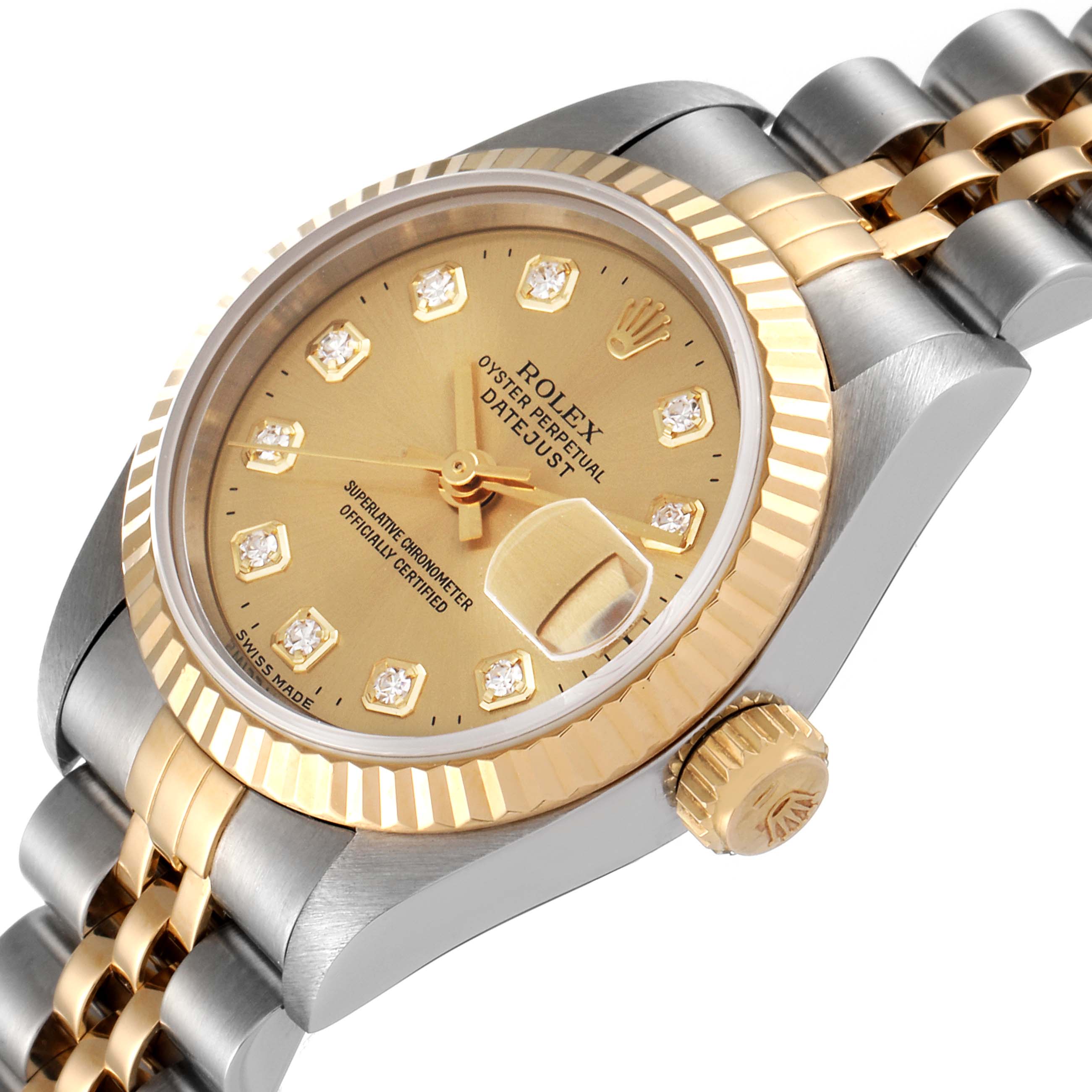 The image shows a close-up of the Rolex Datejust 69173 Women
s Steel and Gold (two tone) Champagne Dial 69173 Women
s Steel and Gold (two tone) Champagne Dial watch at an angle, highlighting the dial, bezel, crown, and part of the bracelet.