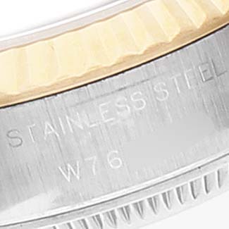This close-up image of a Rolex Datejust 69173 Women
s Steel and Gold (two tone) Champagne Dial 69173 Women
s Steel and Gold (two tone) Champagne Dial watch shows the stainless steel part of the bracelet near the clasp.