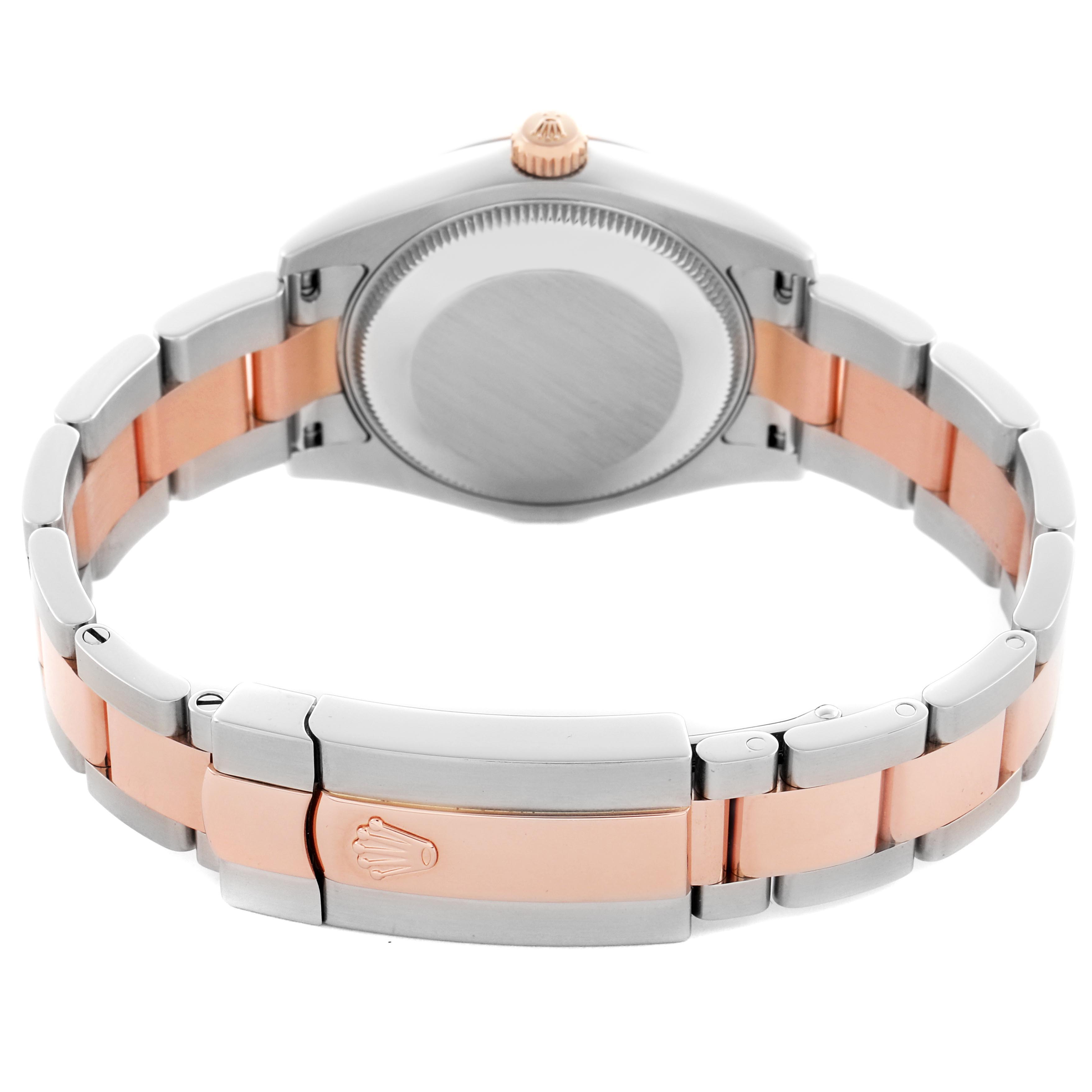 The image shows the back and bracelet of a Mid-Size Rolex watch with a two-tone metal design, highlighting the clasp and caseback.