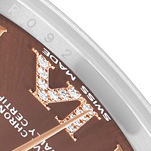 The image shows a close-up of a Rolex Mid-Size 178271 Women's Stainless Steel Brown Dial dial with diamond-set Roman numerals and "Swiss Made" text.