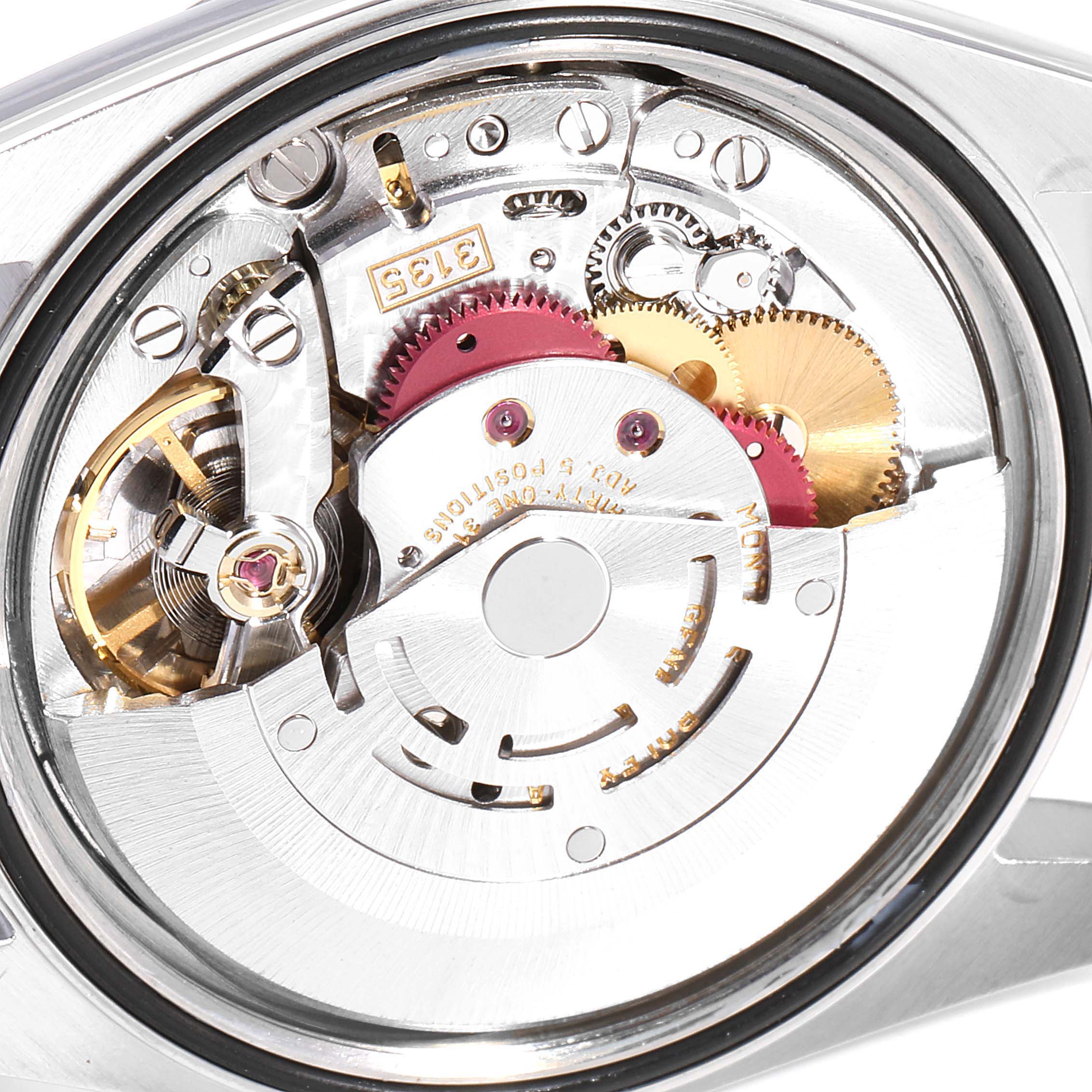 This image shows a close-up of the movement inside a Rolex Datejust 16200 Men
s Stainless Steel Grey Dial 16200 Men
s Stainless Steel Grey Dial watch, highlighting its intricate gears and mechanisms.