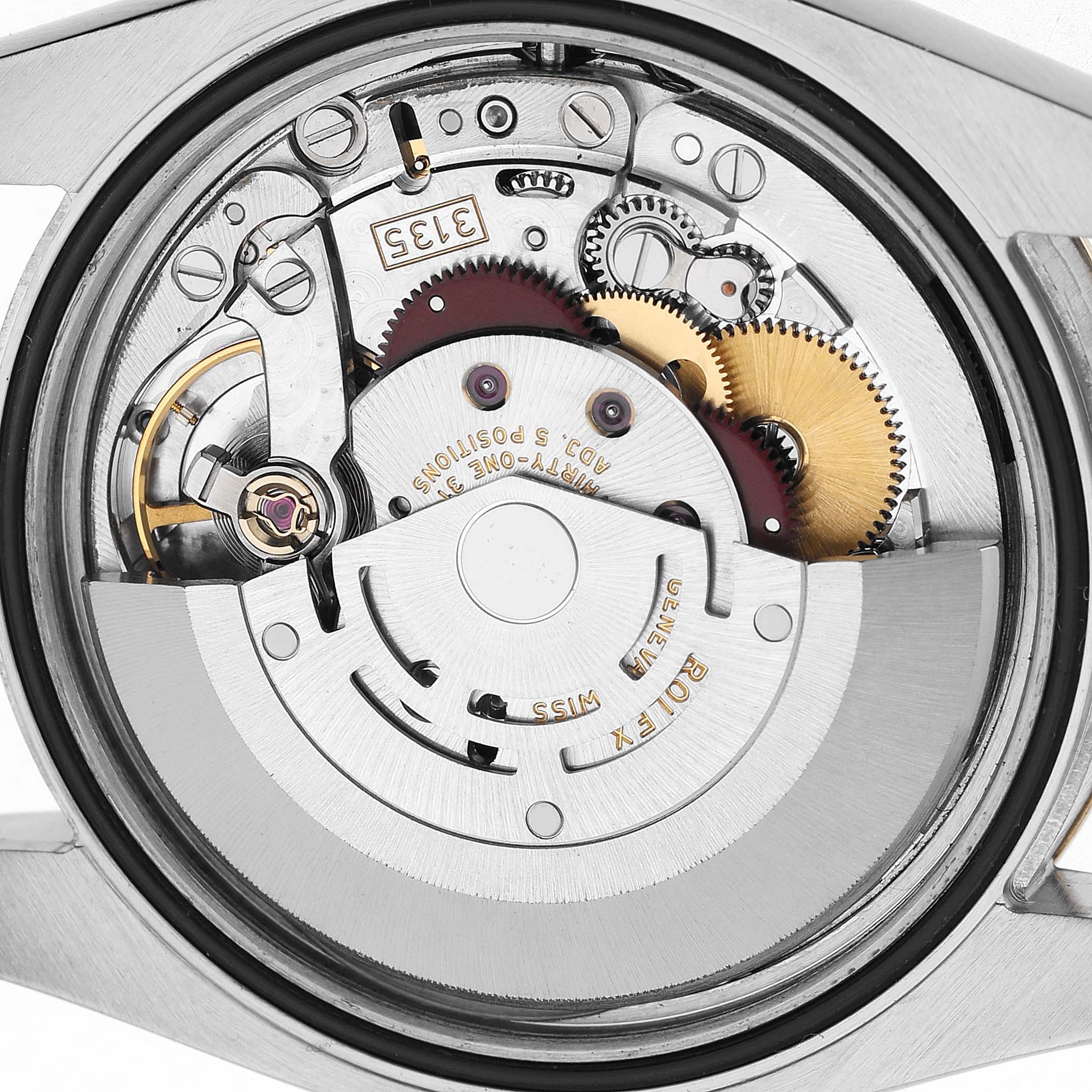 The image shows the movement of a Rolex Datejust 116233 Men's Stainless Steel Champagne Dial, featuring gears and the oscillating weight from a rear angle.