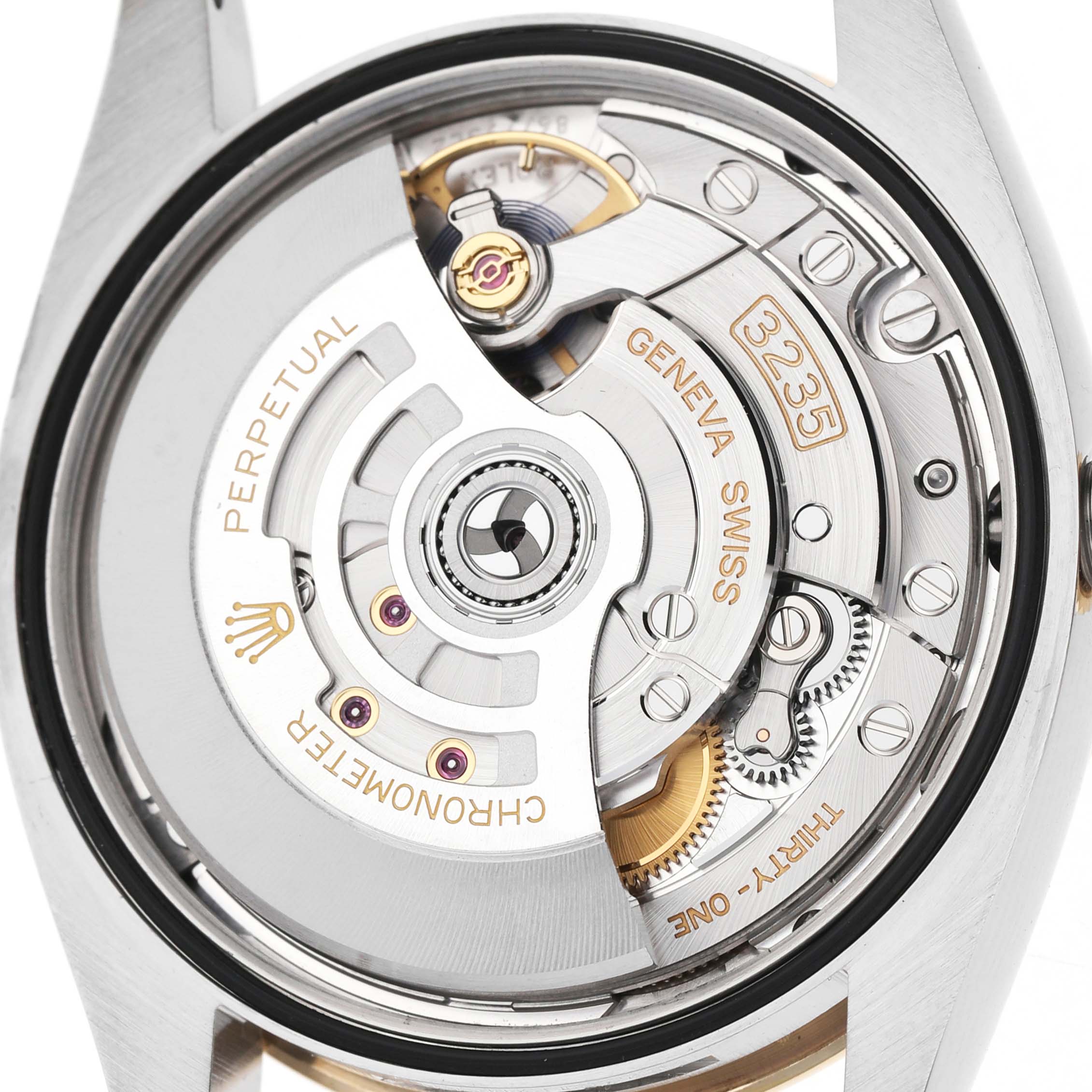 The image shows the movement and inner workings of a Rolex Datejust 126233 Men's Stainless Steel Champagne Dial watch from a back view angle.