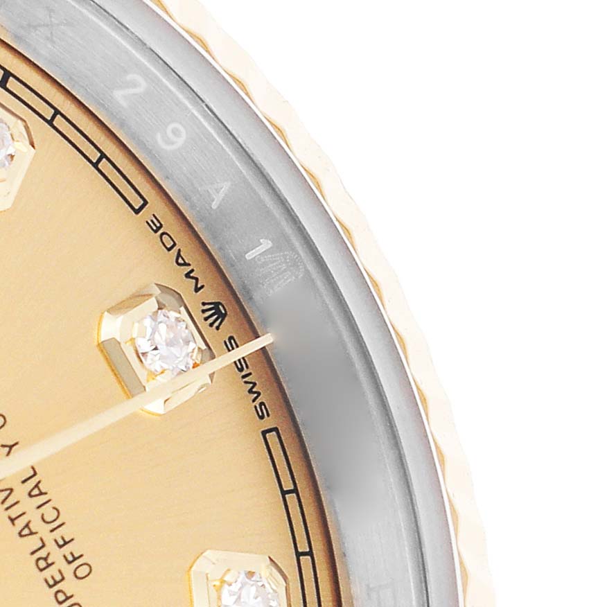 The image shows a close-up of the dial edge, bezel, and a diamond marker on a Rolex Datejust 126233 Men's Stainless Steel Champagne Dial watch.