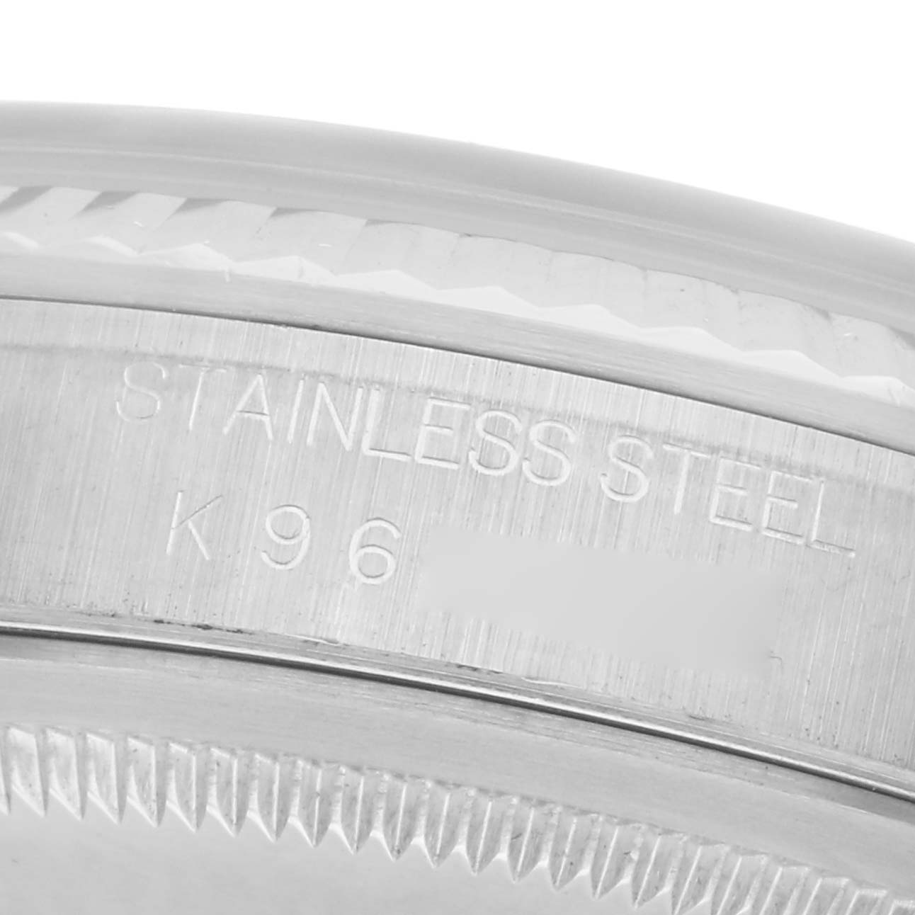 The image shows a close-up of the stainless steel bezel and edge of the case back of a Rolex Datejust 16234 Men's Stainless Steel White Dial 16234 Men's Stainless Steel White Dial watch.