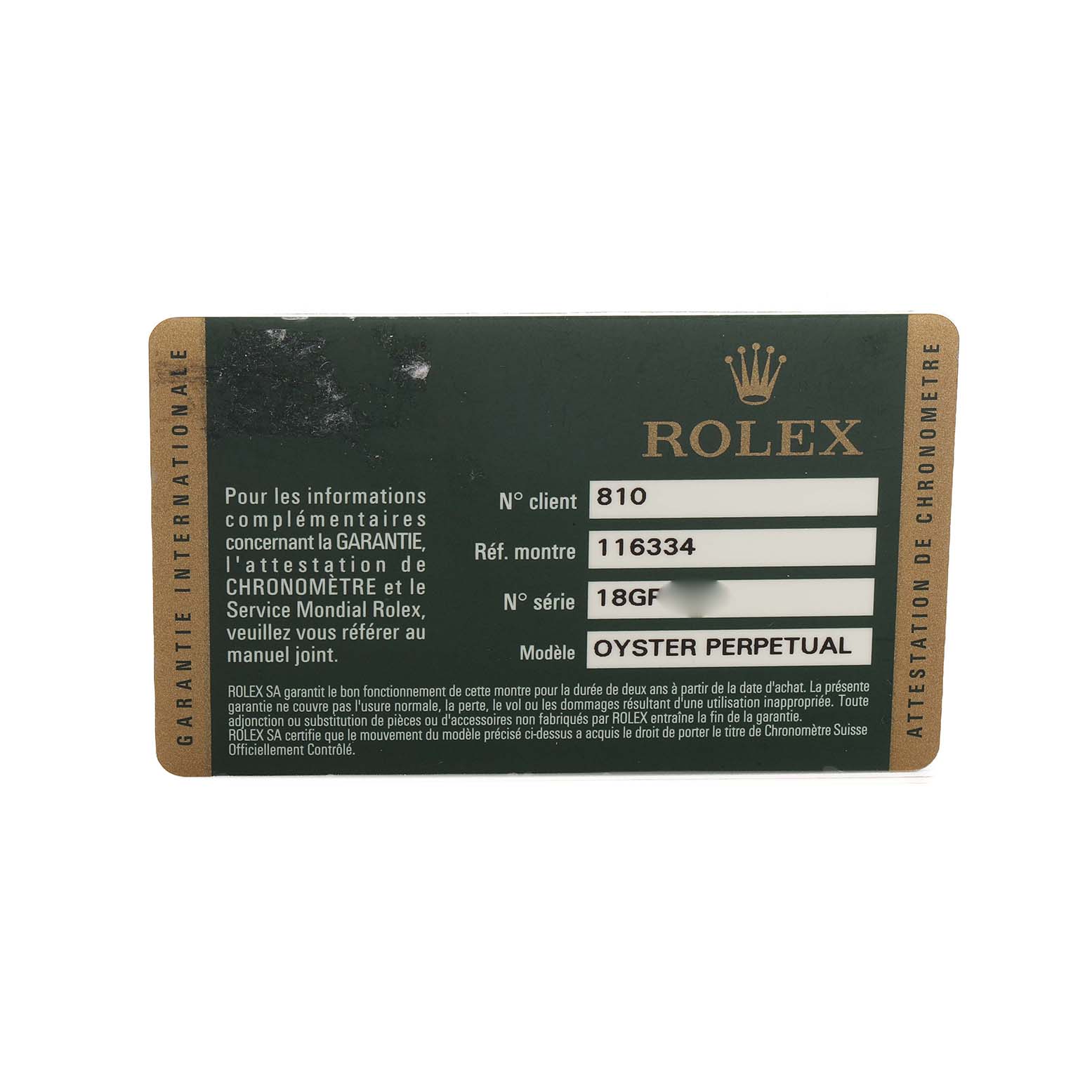 This image shows a Rolex warranty card for an Oyster Perpetual model, displaying client and reference numbers.
