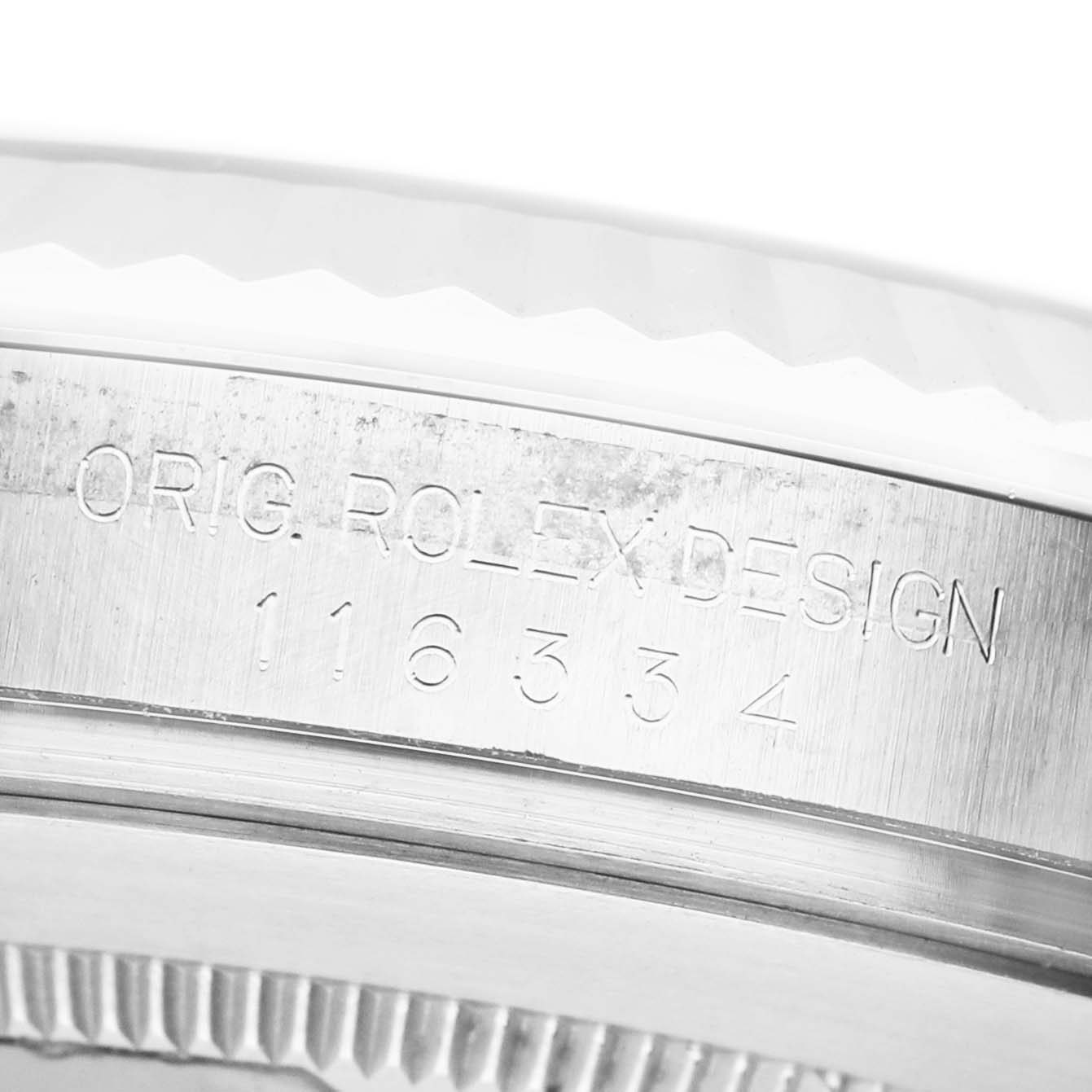 This image shows a close-up of the side engraving on the bezel of a Rolex Datejust 41 116334 Men's Stainless Steel Blue Dial watch.