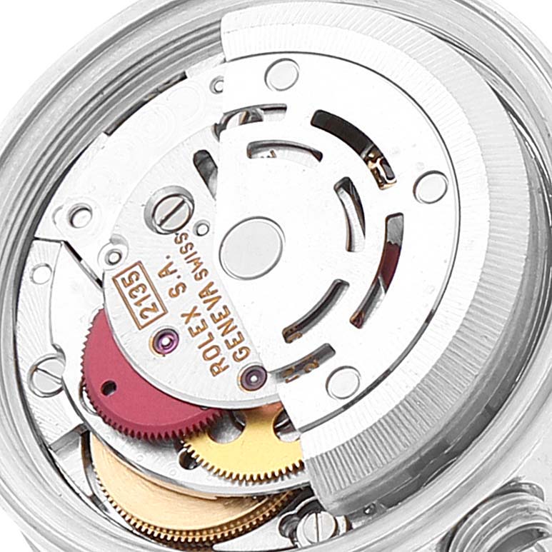 The image shows a close-up view of the movement mechanism of a Rolex Datejust 69174 Women
s Stainless Steel Blue Dial 69174 Women
s Stainless Steel Blue Dial watch.