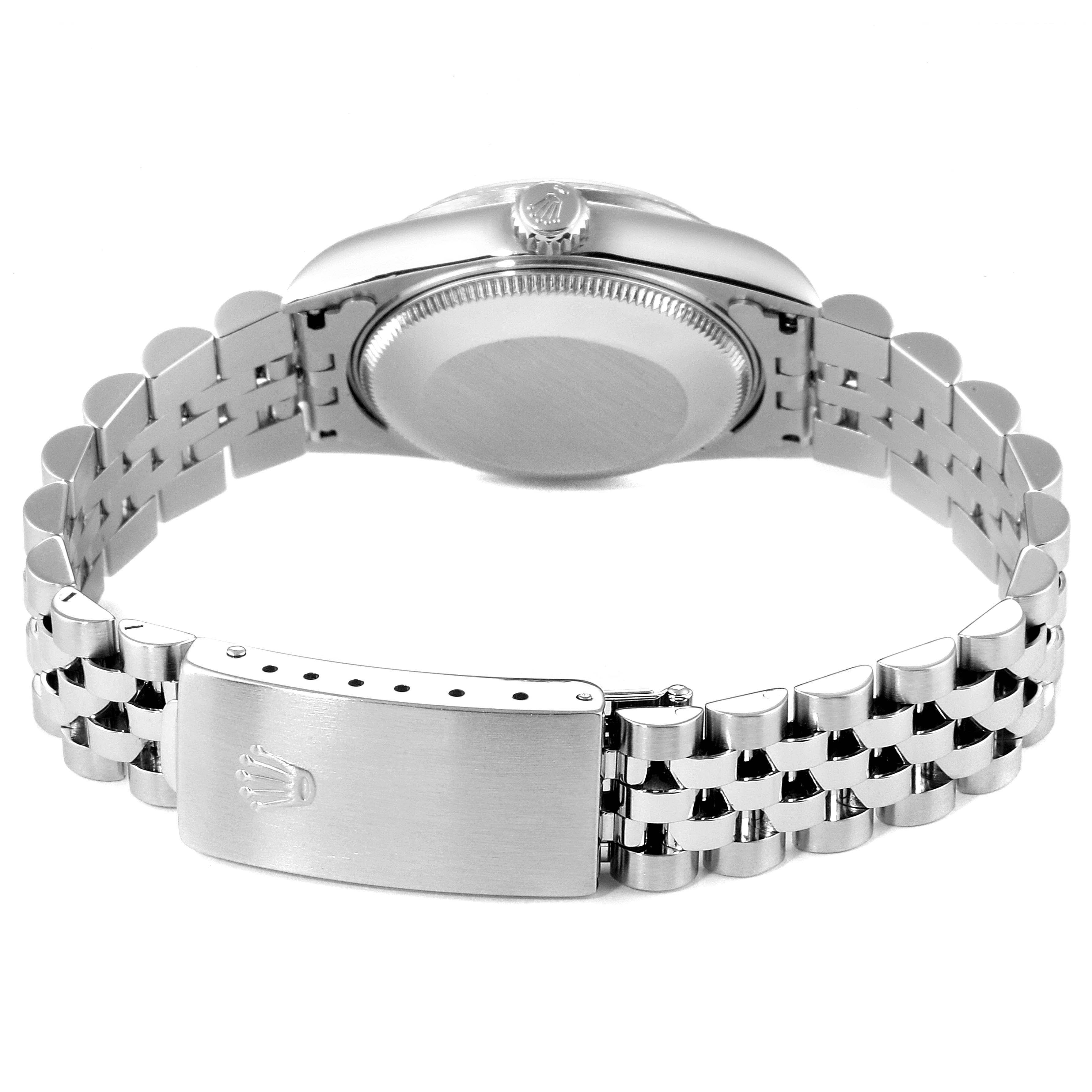 The image shows the back view of a Mid-Size Rolex watch, specifically focusing on the caseback and bracelet with the clasp visible.