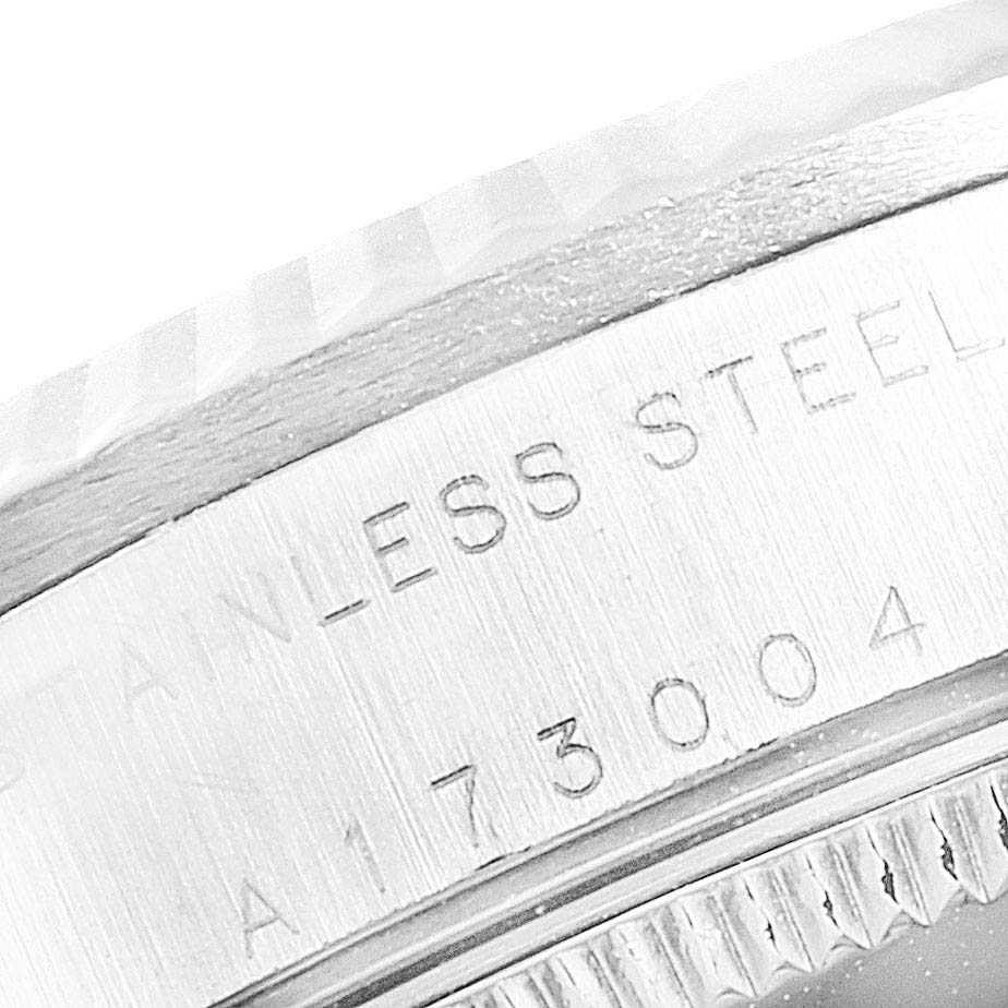 The image shows a close-up angle of the Rolex Mid-Size 78274 Women
s Stainless Steel White Dial 78274 Women
s Stainless Steel White Dial watch
s stainless steel case back with engraved numbers.