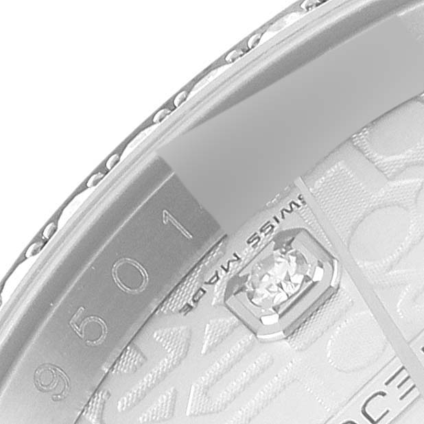 This image shows a close-up of the bezel and part of the dial of a Rolex Datejust 116244 Men's Stainless Steel Silver Dial 116244 Men's Stainless Steel Silver Dial watch, highlighting the "SWISS MADE" text and diamond hour marker.