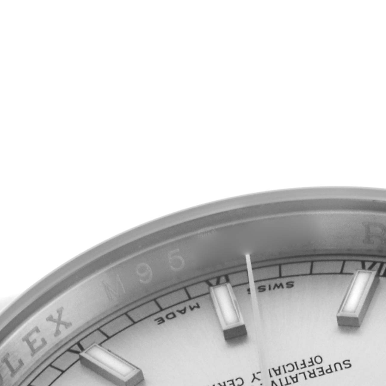 The image shows a close-up of the Rolex Datejust 116200 Men's Stainless Steel Silver Dial 116200 Men's Stainless Steel Silver Dial watch dial, focusing on the hour markers and partial view of the bezel.