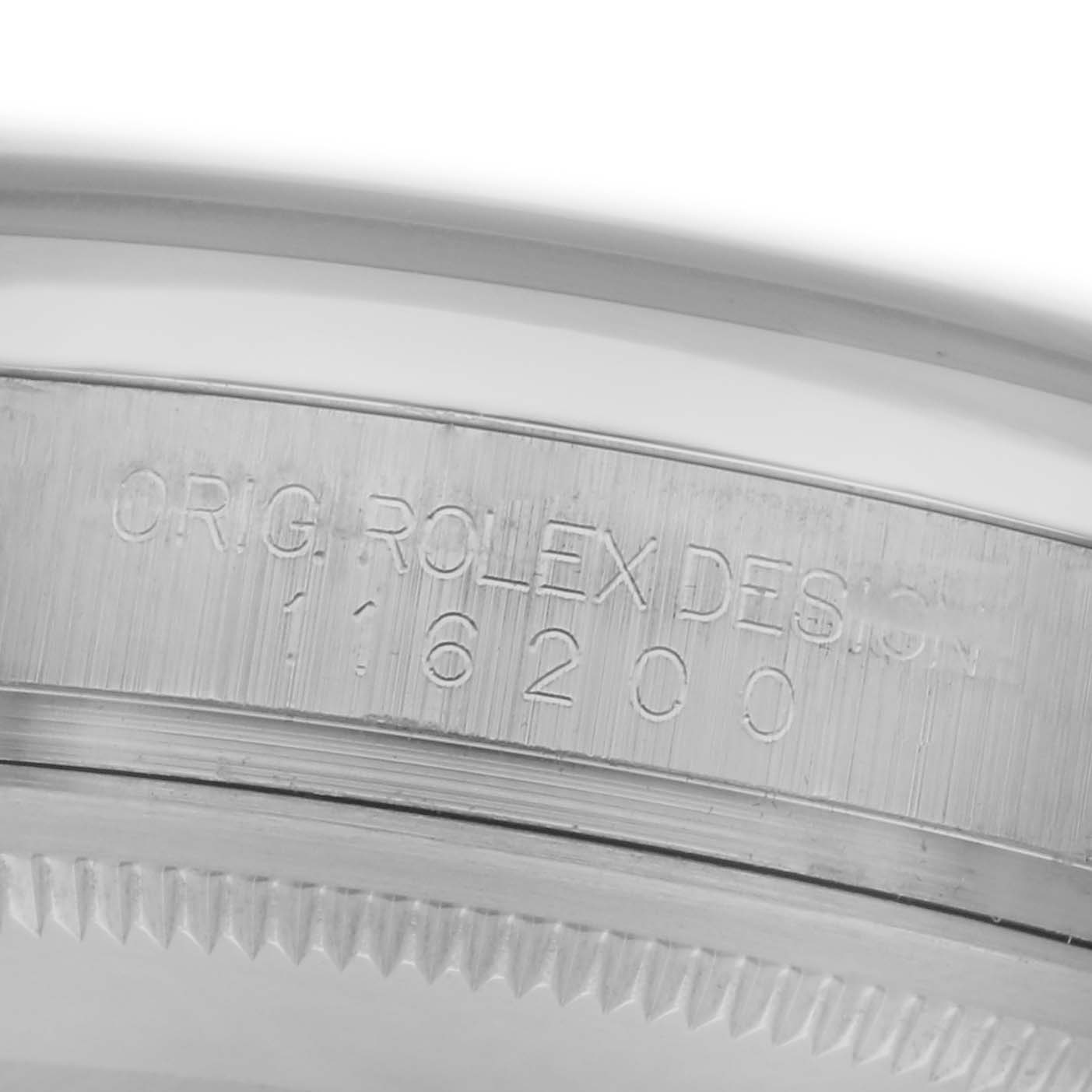The image shows a close-up angle of the case side of the Rolex Datejust 116200 Men's Stainless Steel Silver Dial 116200 Men's Stainless Steel Silver Dial, displaying model engraving details.