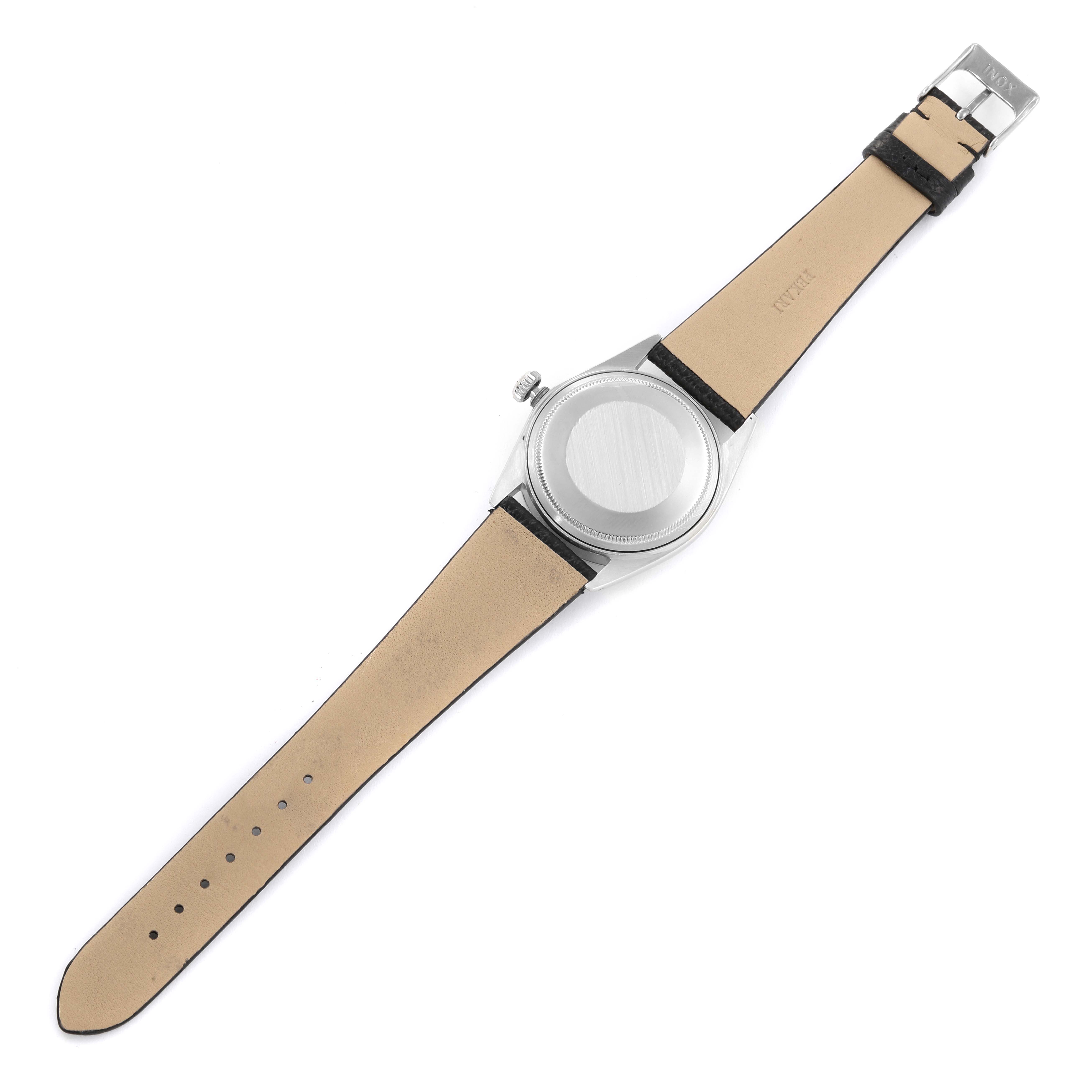 The image shows the back view of a Rolex Vintage Collection 1601 Men's Stainless Steel Black Dial 1601 Men's Stainless Steel Black Dial watch, highlighting the case back and leather strap.