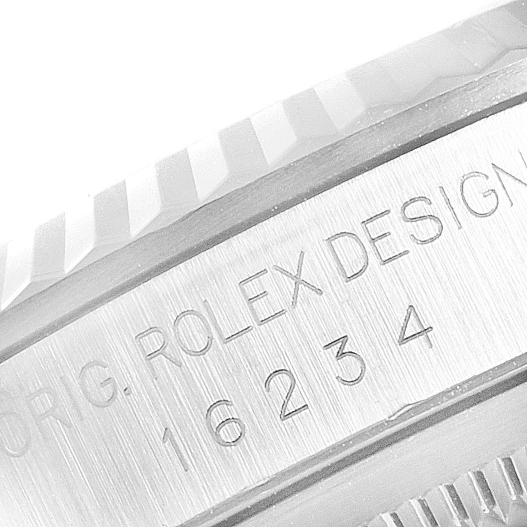 The image shows a close-up of the Rolex Datejust 16234 Men
s Stainless Steel Black Dial 16234 Men
s Stainless Steel Black Dial model
s case side, featuring the engraved model number and design details.