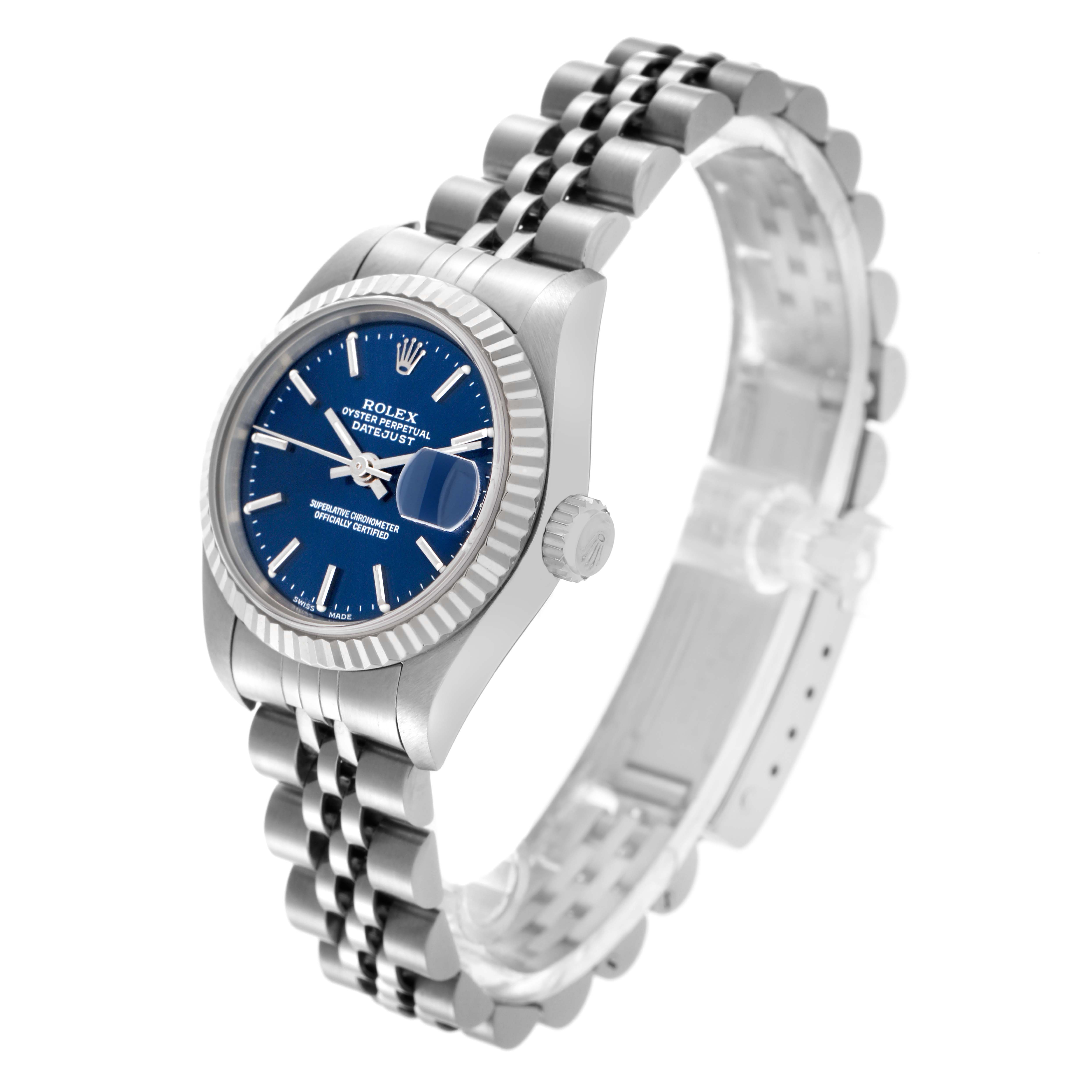 The Rolex Datejust 79174 Women
s Stainless Steel Blue Dial 79174 Women
s Stainless Steel Blue Dial watch is shown at an angled side view, highlighting the blue dial, fluted bezel, and Jubilee bracelet.