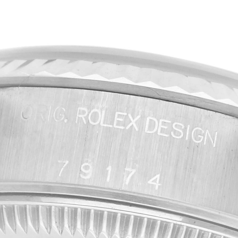 The image shows an angled close-up of the side casing of a Rolex Datejust 79174 Women
s Stainless Steel Blue Dial 79174 Women
s Stainless Steel Blue Dial, highlighting the engraved model number.