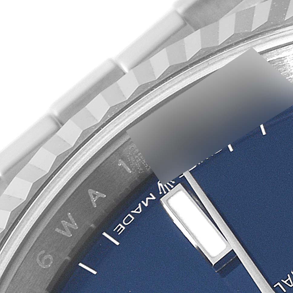 The image shows a close-up of the bezel, part of the dial, and bracelet of a Rolex Datejust 126234 Men's Stainless Steel Blue Dial 126234 Men's Stainless Steel Blue Dial watch.