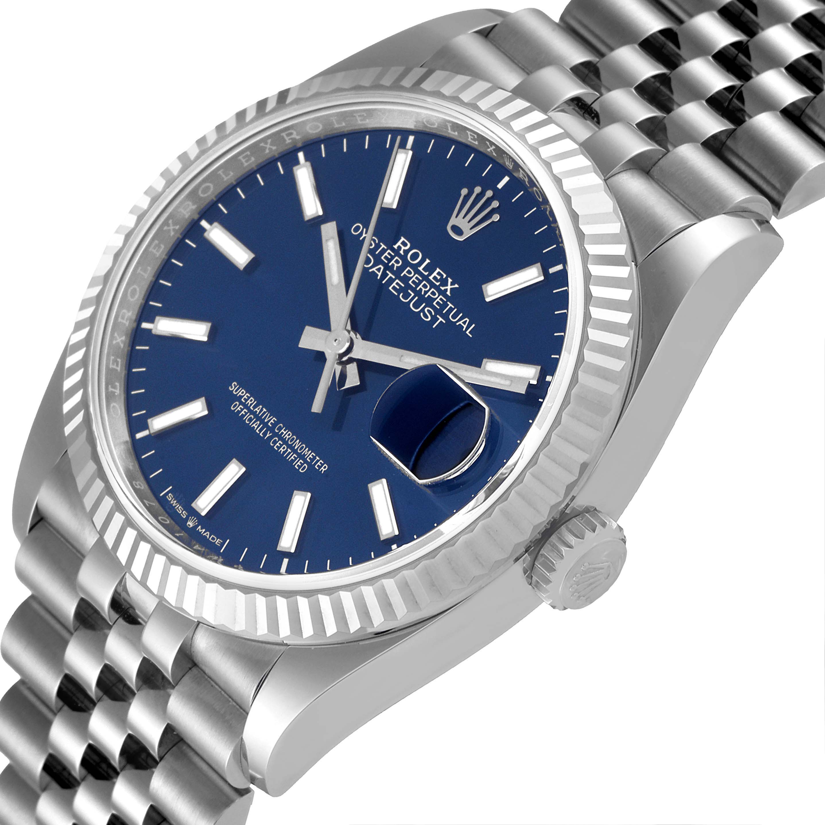 This image shows a Rolex Datejust 126234 Men's Stainless Steel Blue Dial 126234 Men's Stainless Steel Blue Dial watch at an angled close-up, displaying the blue dial, crown, fluted bezel, and Jubilee bracelet.