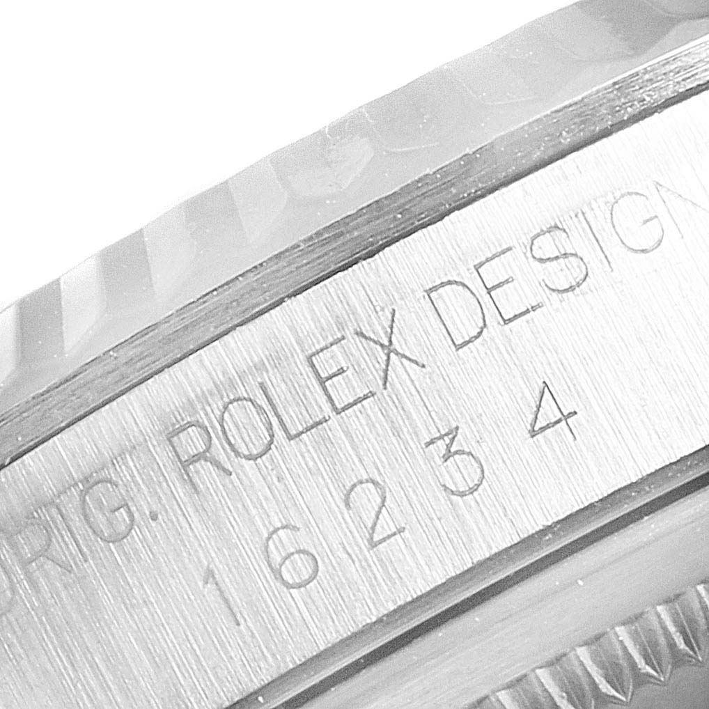 This close-up angle shows the engraved serial and model number of a Rolex Datejust 16234 Men
s Stainless Steel Blue Dial 16234 Men
s Stainless Steel Blue Dial watch.
