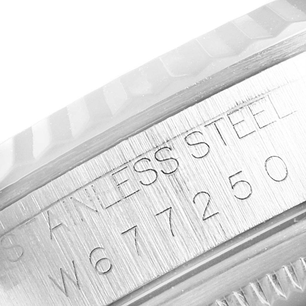 The image shows a close-up of the edge and serial number of a Rolex Datejust 16234 Men
s Stainless Steel Blue Dial 16234 Men
s Stainless Steel Blue Dial watch, highlighting the stainless steel material.