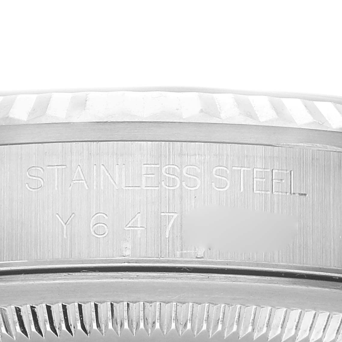 The image shows a close-up of the case side of a Rolex Datejust 16234 Men's Stainless Steel White Dial 16234 Men's Stainless Steel White Dial watch, highlighting the "STAINLESS STEEL" engraving.
