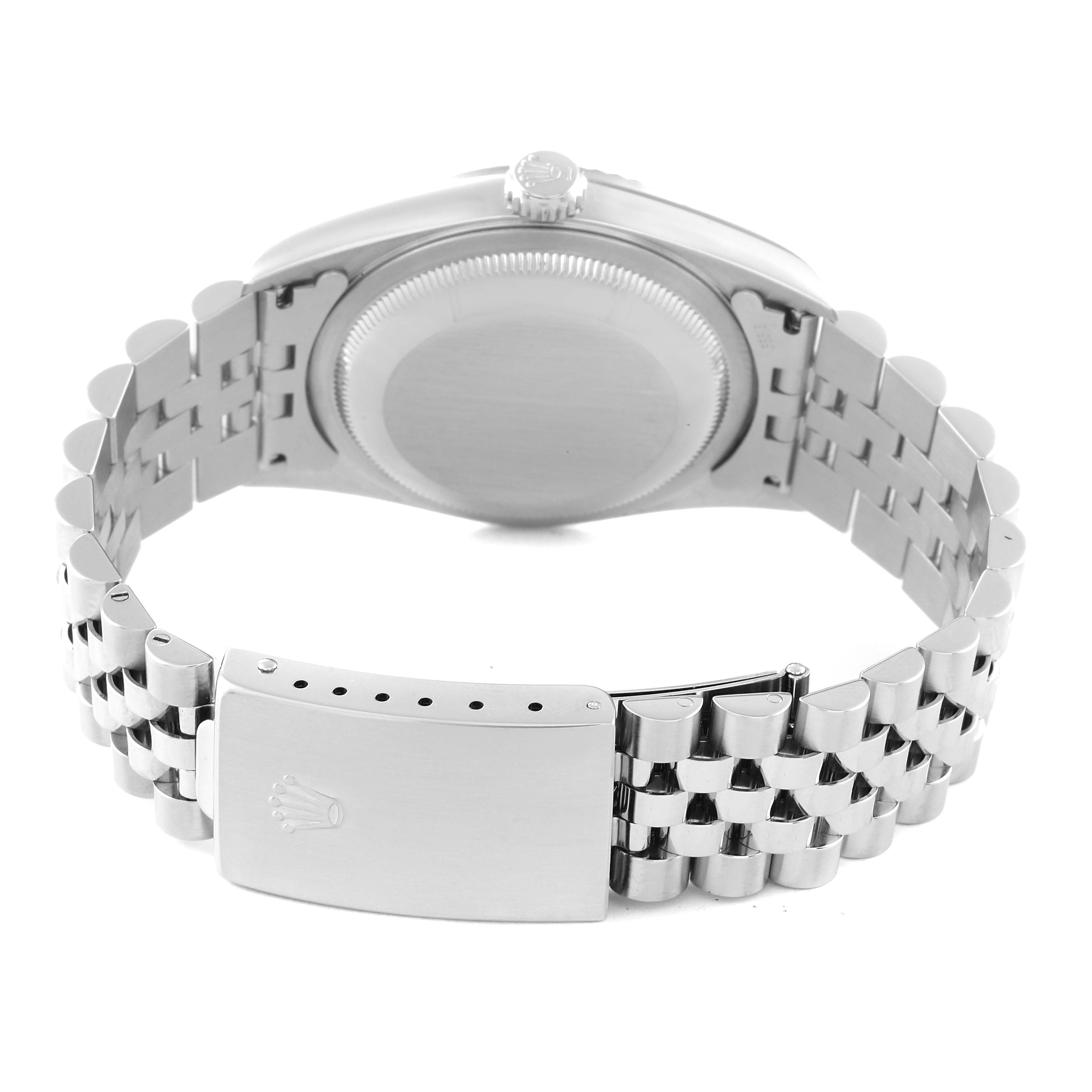 The image shows the back of a Rolex Datejust 16234 Men's Stainless Steel White Dial 16234 Men's Stainless Steel White Dial watch, focusing on the caseback, crown, and metal bracelet with the clasp open.