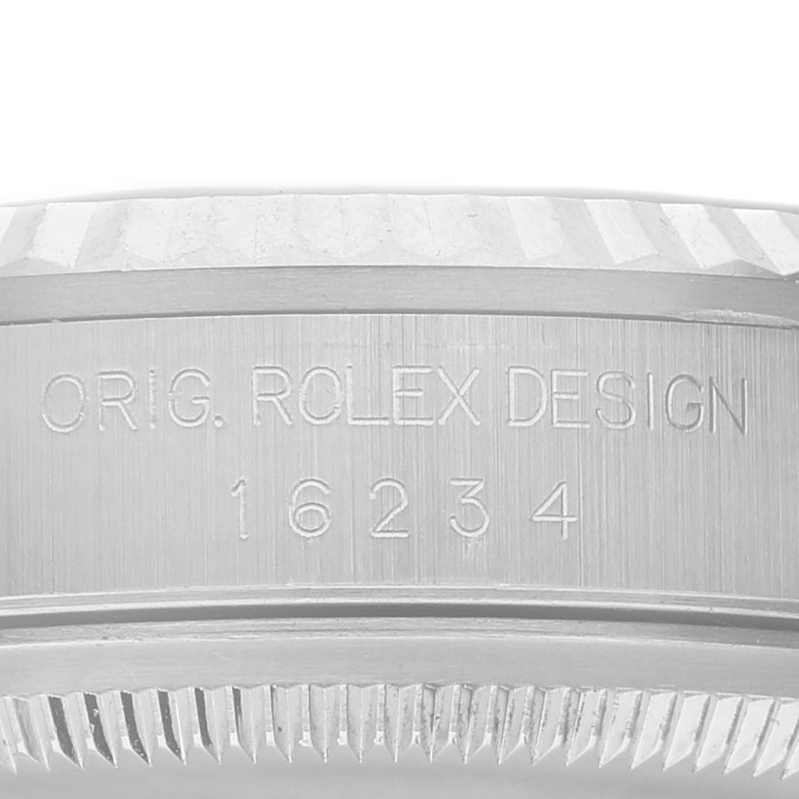 This image shows the model number engraving on the side of the bezel of a Rolex Datejust 16234 Men's Stainless Steel White Dial 16234 Men's Stainless Steel White Dial watch.