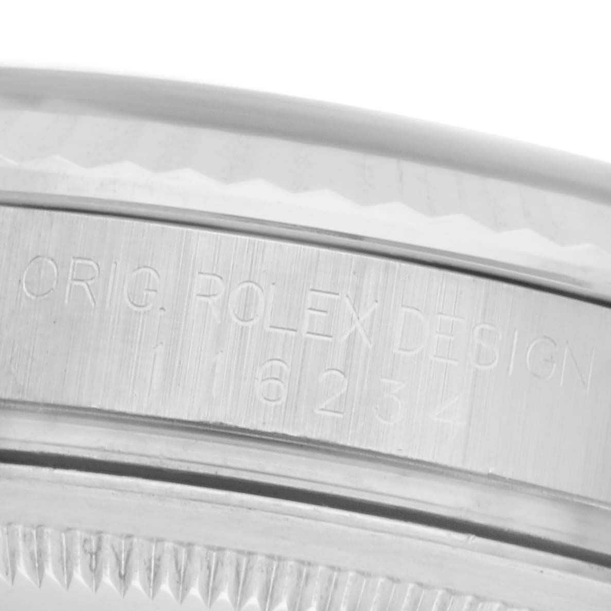 The image shows the side engraving on the case of a Rolex Datejust 116234 Men's Stainless Steel White Dial 116234 Men's Stainless Steel White Dial watch, highlighting the model number and "Orig. Rolex Design."