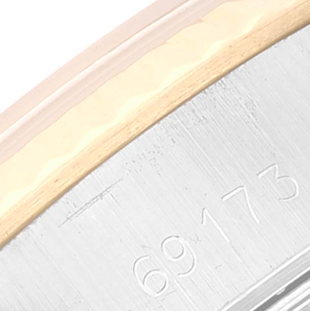 The image shows a close-up of the edge of a Rolex Datejust 69173 Women's Steel and Gold (two tone) Champagne Dial 69173 Women's Steel and Gold (two tone) Champagne Dial watch case, revealing part of the model number "69173" and some of the bezel.